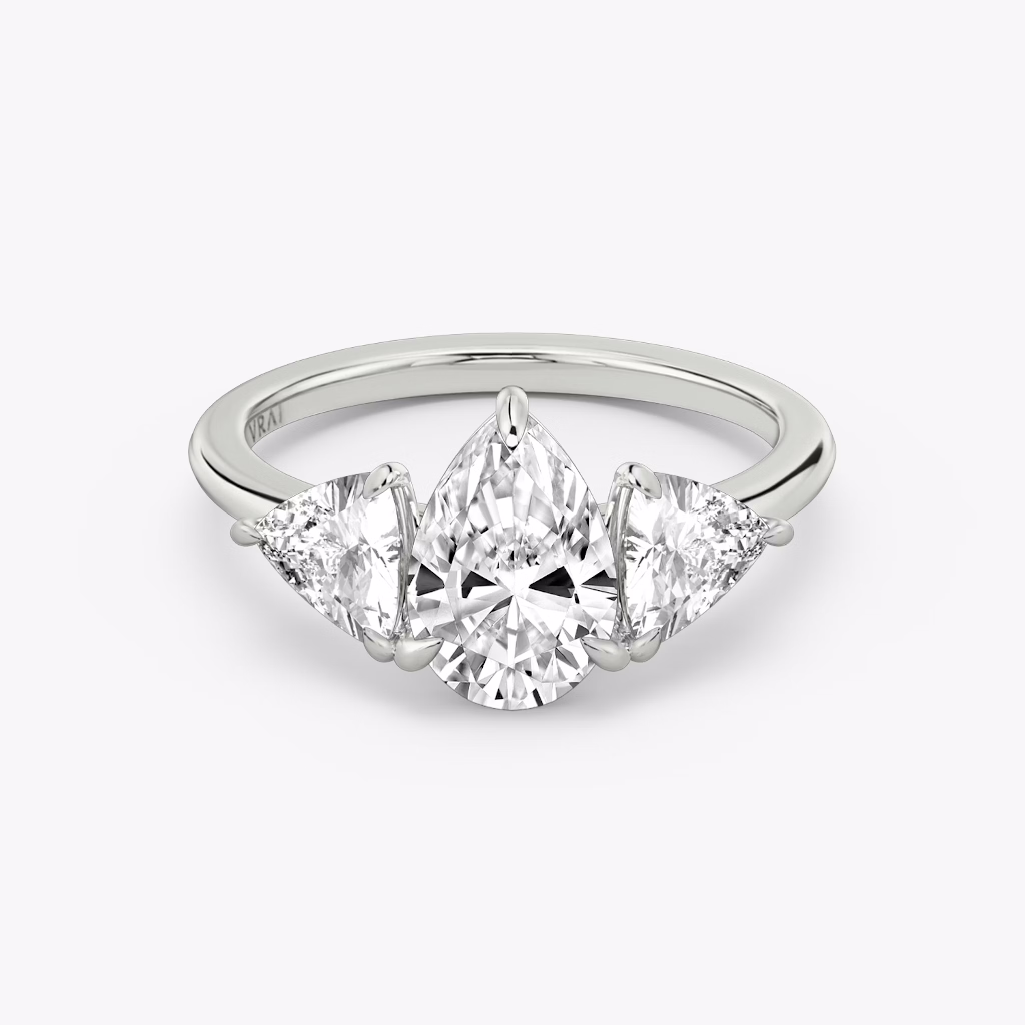 The Three Stone | Pear | 18k | White Gold | bandAccent: Plain | sideStoneCarat: 0.50ct | sideStoneShape: Trillion | diamondOrientation: vertical | caratWeight: other