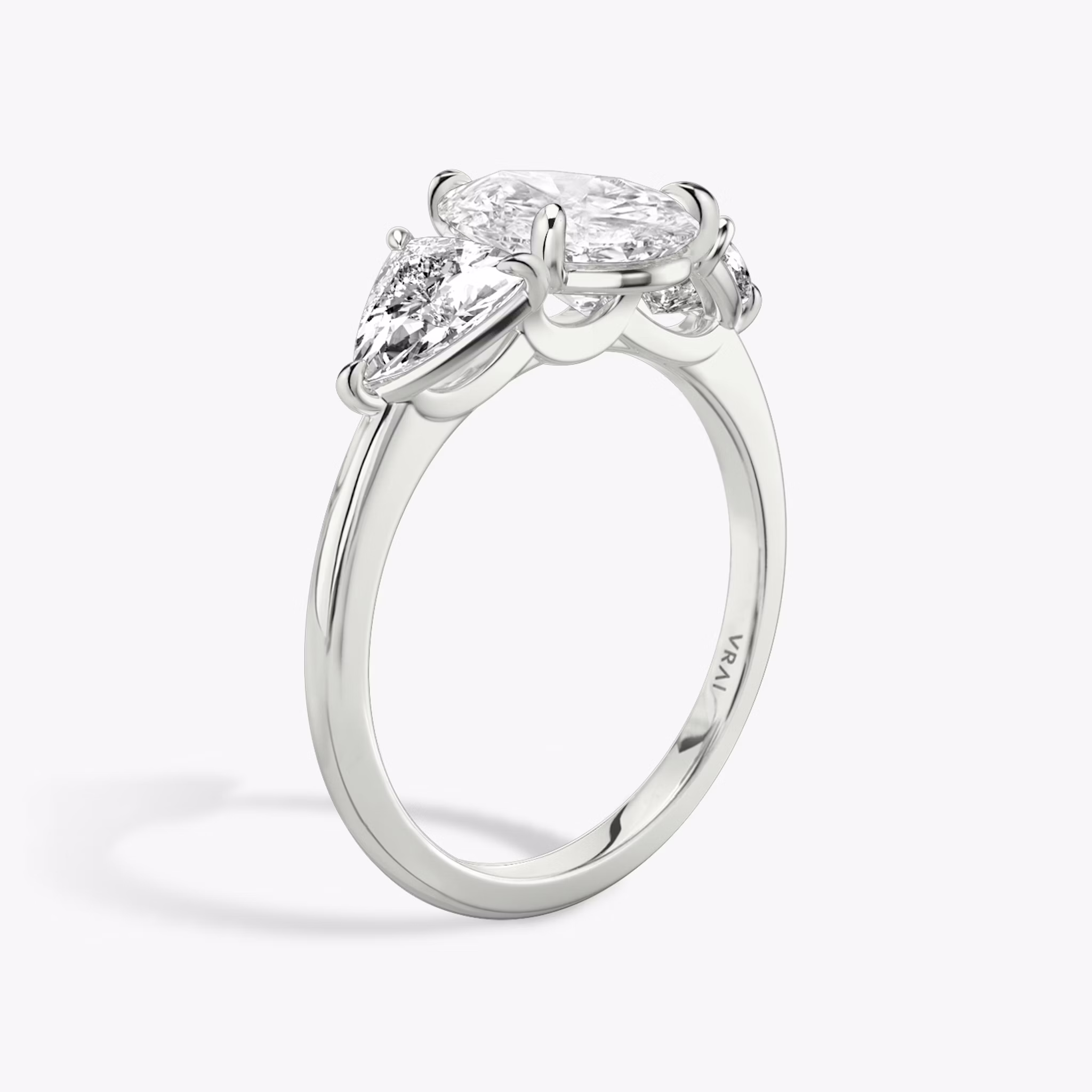 The Three Stone | Pear | 18k | White Gold | bandAccent: Plain | sideStoneCarat: 0.50ct | sideStoneShape: Trillion | diamondOrientation: vertical | caratWeight: other