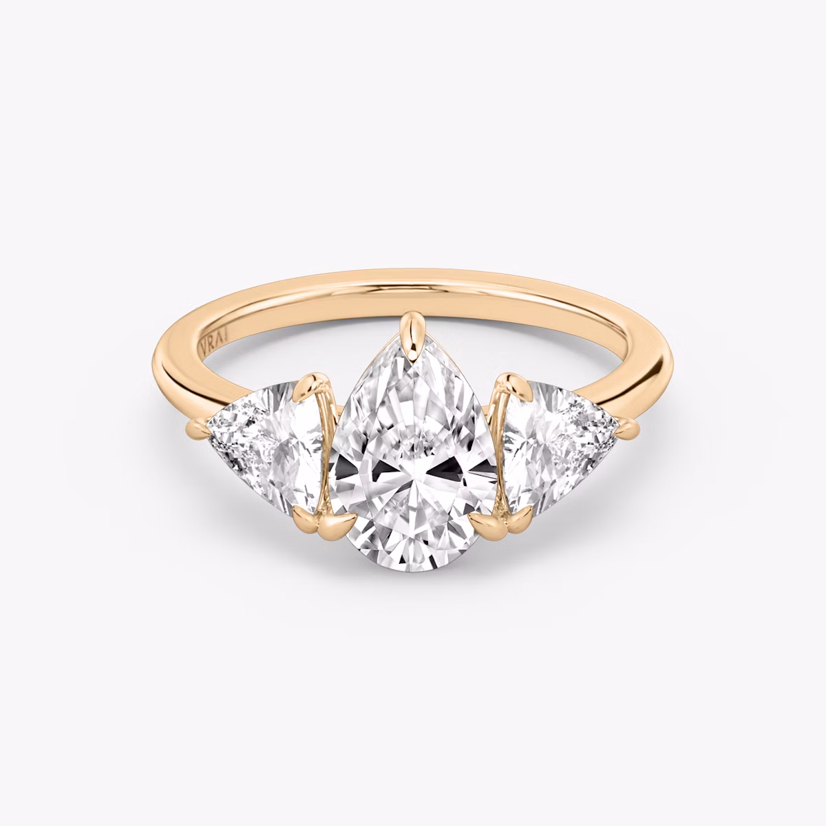 The Three Stone | Pear | 14k | Rose Gold | bandAccent: Plain | sideStoneCarat: 0.50ct | sideStoneShape: Trillion | diamondOrientation: vertical | caratWeight: other