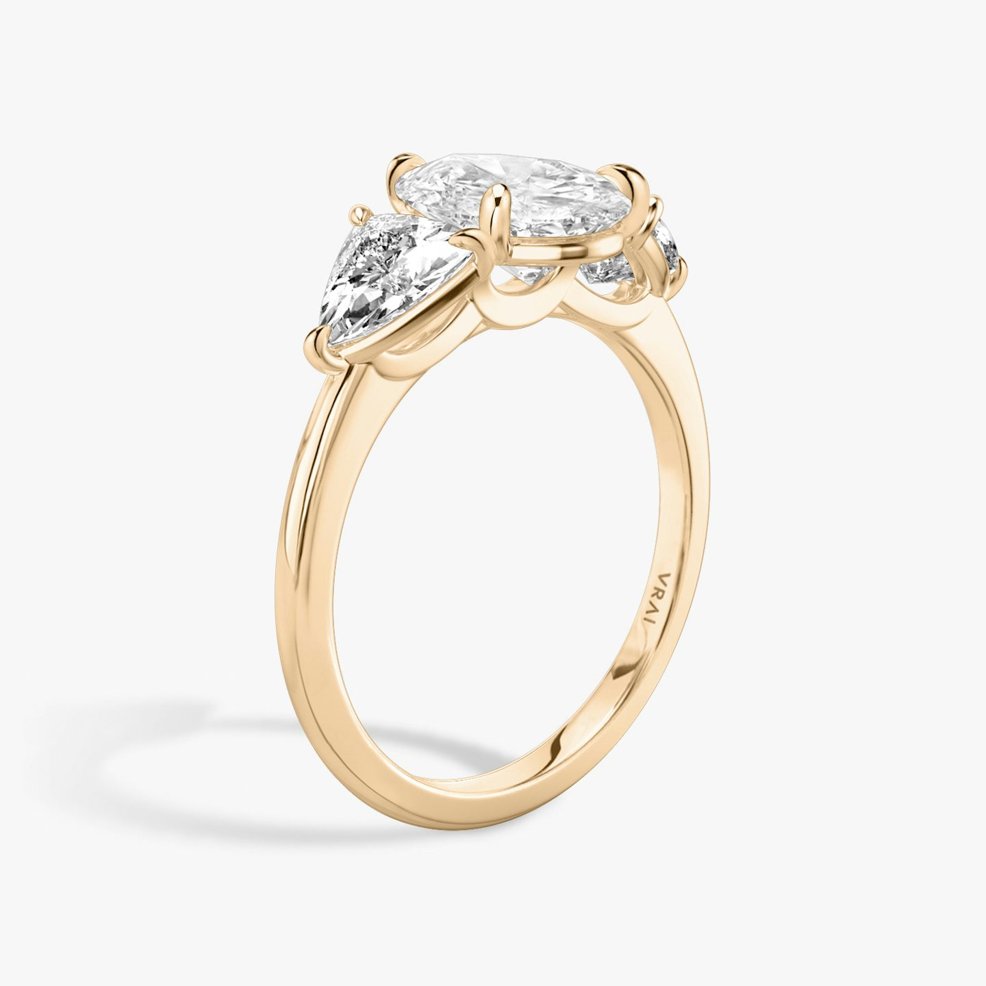 The Three Stone | Pear | 14k | Rose Gold | bandAccent: Plain | sideStoneCarat: 0.50ct | sideStoneShape: Trillion | diamondOrientation: vertical | caratWeight: other