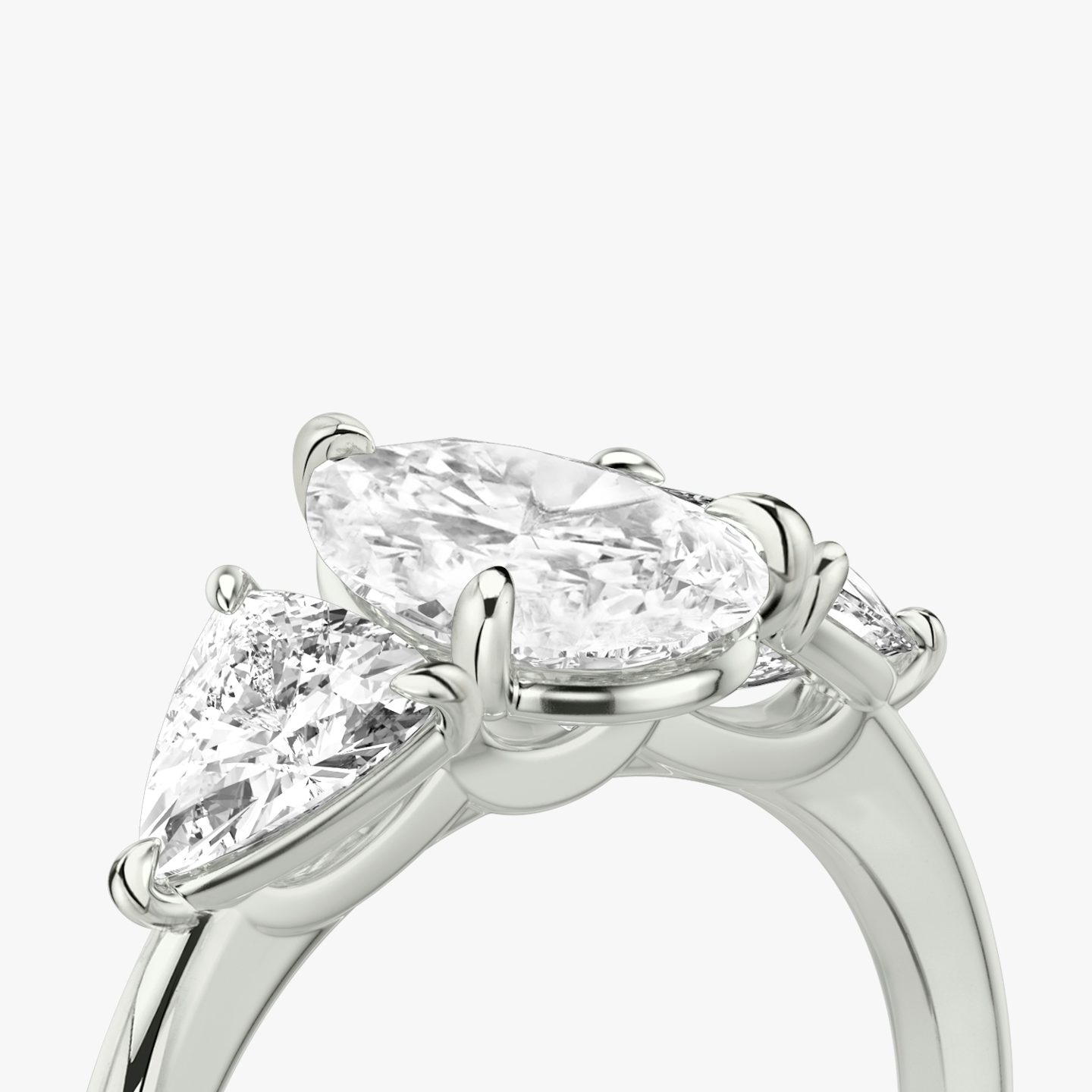 The Three Stone | Pear | Platinum | bandAccent: Plain | sideStoneCarat: 0.50ct | sideStoneShape: Trillion | diamondOrientation: vertical | caratWeight: other