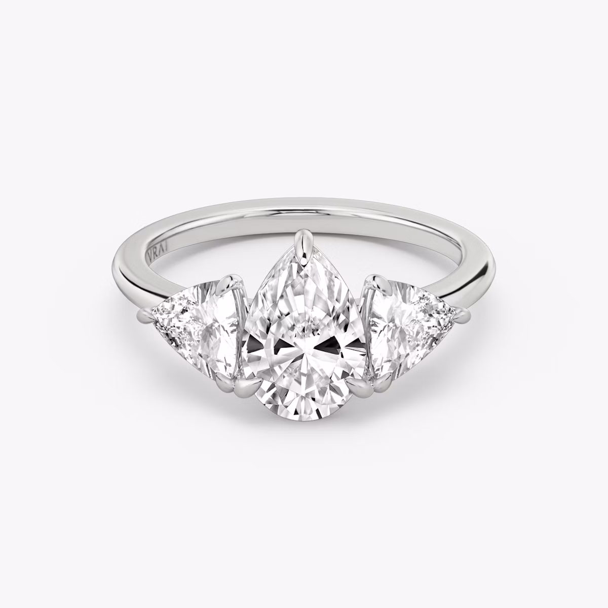 The Three Stone | Pear | Platinum | bandAccent: Plain | sideStoneCarat: 0.50ct | sideStoneShape: Trillion | diamondOrientation: vertical | caratWeight: other