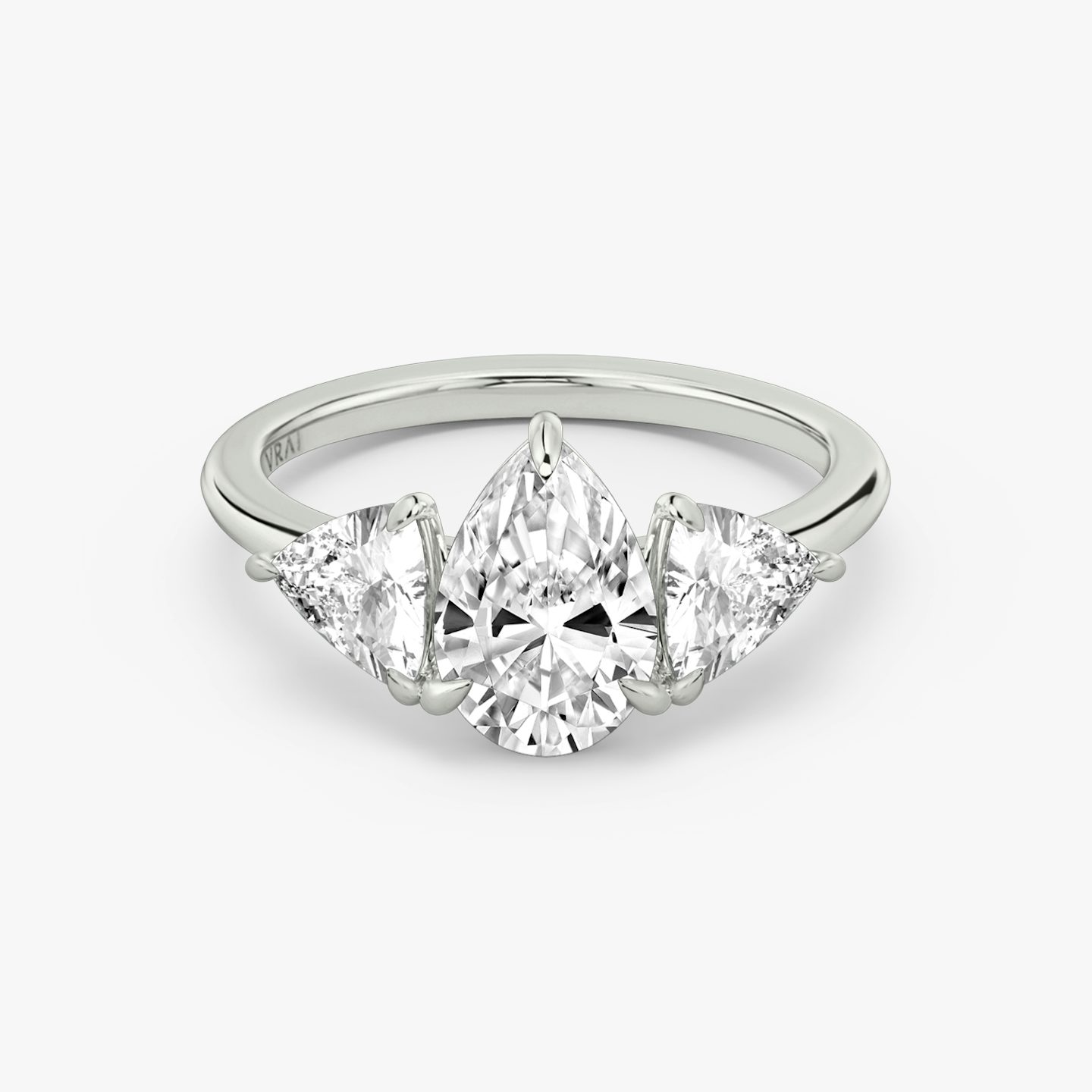 The Three Stone | Pear | Platinum | bandAccent: Plain | sideStoneCarat: 0.50ct | sideStoneShape: Trillion | diamondOrientation: vertical | caratWeight: other