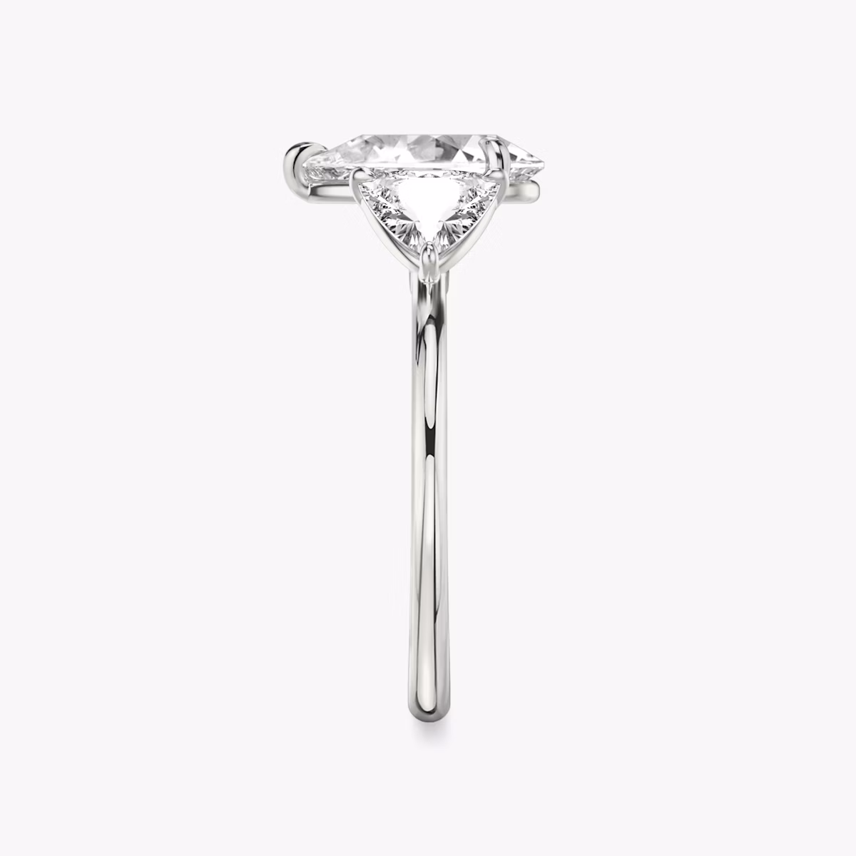 The Three Stone | Pear | Platinum | bandAccent: Plain | sideStoneCarat: 0.50ct | sideStoneShape: Trillion | diamondOrientation: vertical | caratWeight: other