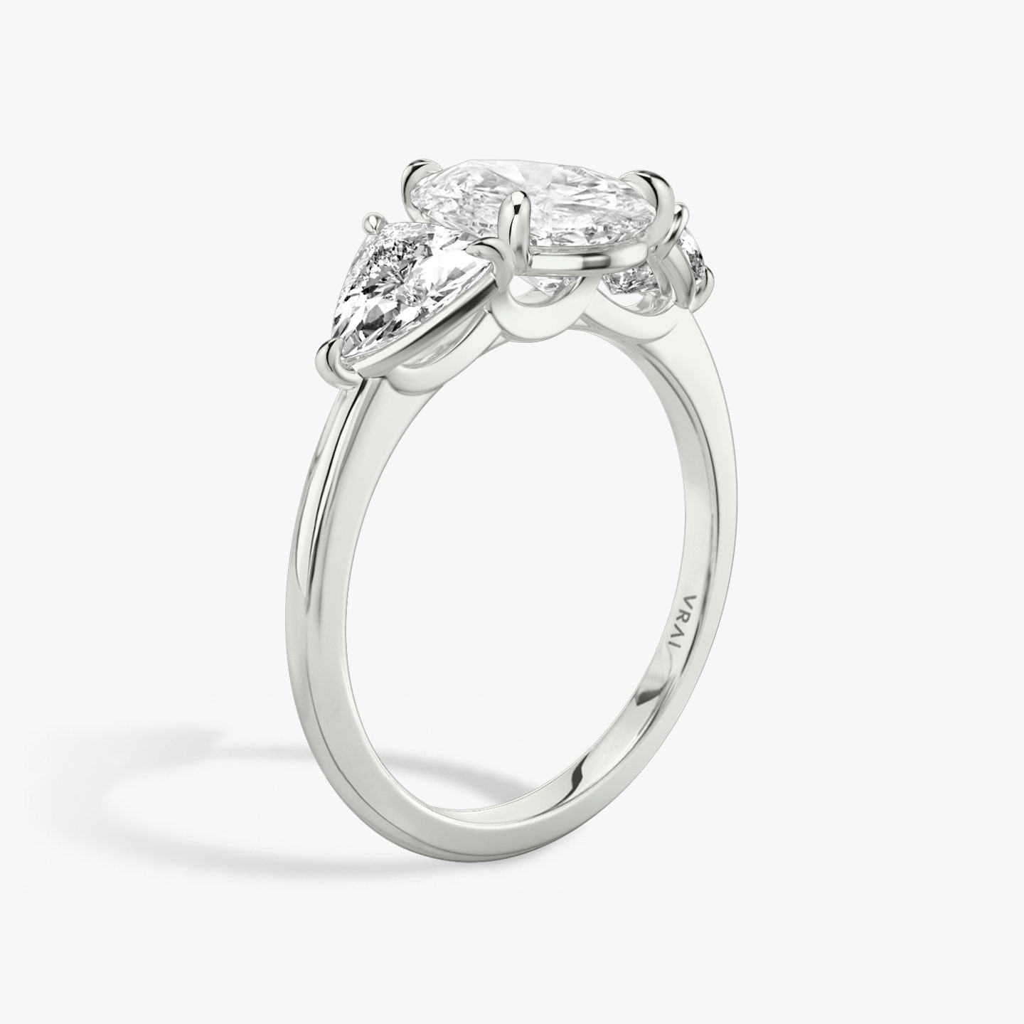The Three Stone | Pear | Platinum | bandAccent: Plain | sideStoneCarat: 0.50ct | sideStoneShape: Trillion | diamondOrientation: vertical | caratWeight: other