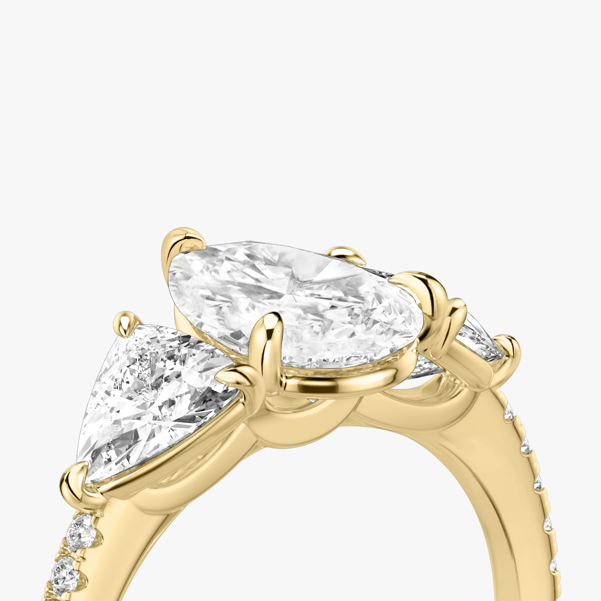 The Three Stone | Pear | 18k | Yellow Gold | bandAccent: Pavé | sideStoneCarat: 0.50ct | sideStoneShape: Trillion | diamondOrientation: vertical | caratWeight: other
