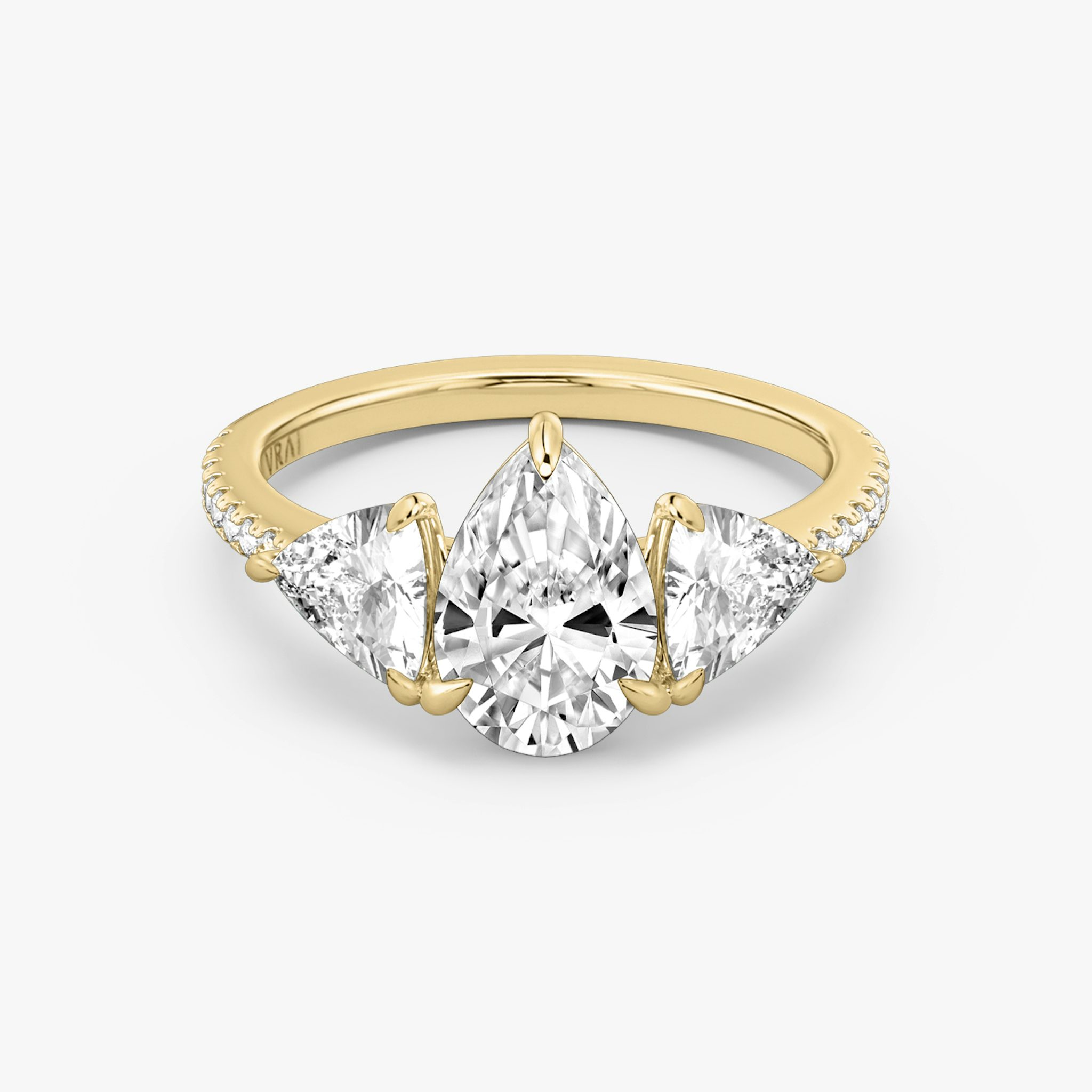 The Three Stone | Pear | 18k | Yellow Gold | bandAccent: Pavé | sideStoneCarat: 0.50ct | sideStoneShape: Trillion | diamondOrientation: vertical | caratWeight: other