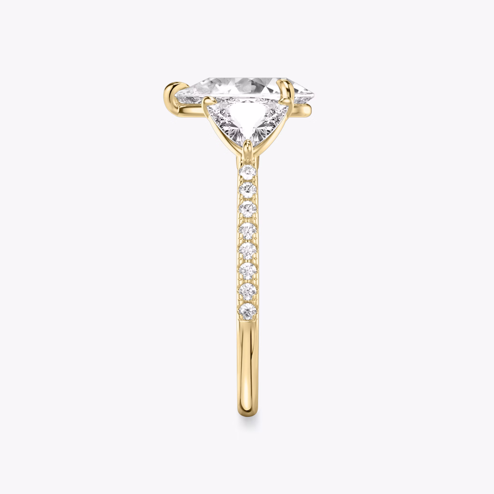 The Three Stone | Pear | 18k | Yellow Gold | bandAccent: Pavé | sideStoneCarat: 0.50ct | sideStoneShape: Trillion | diamondOrientation: vertical | caratWeight: other