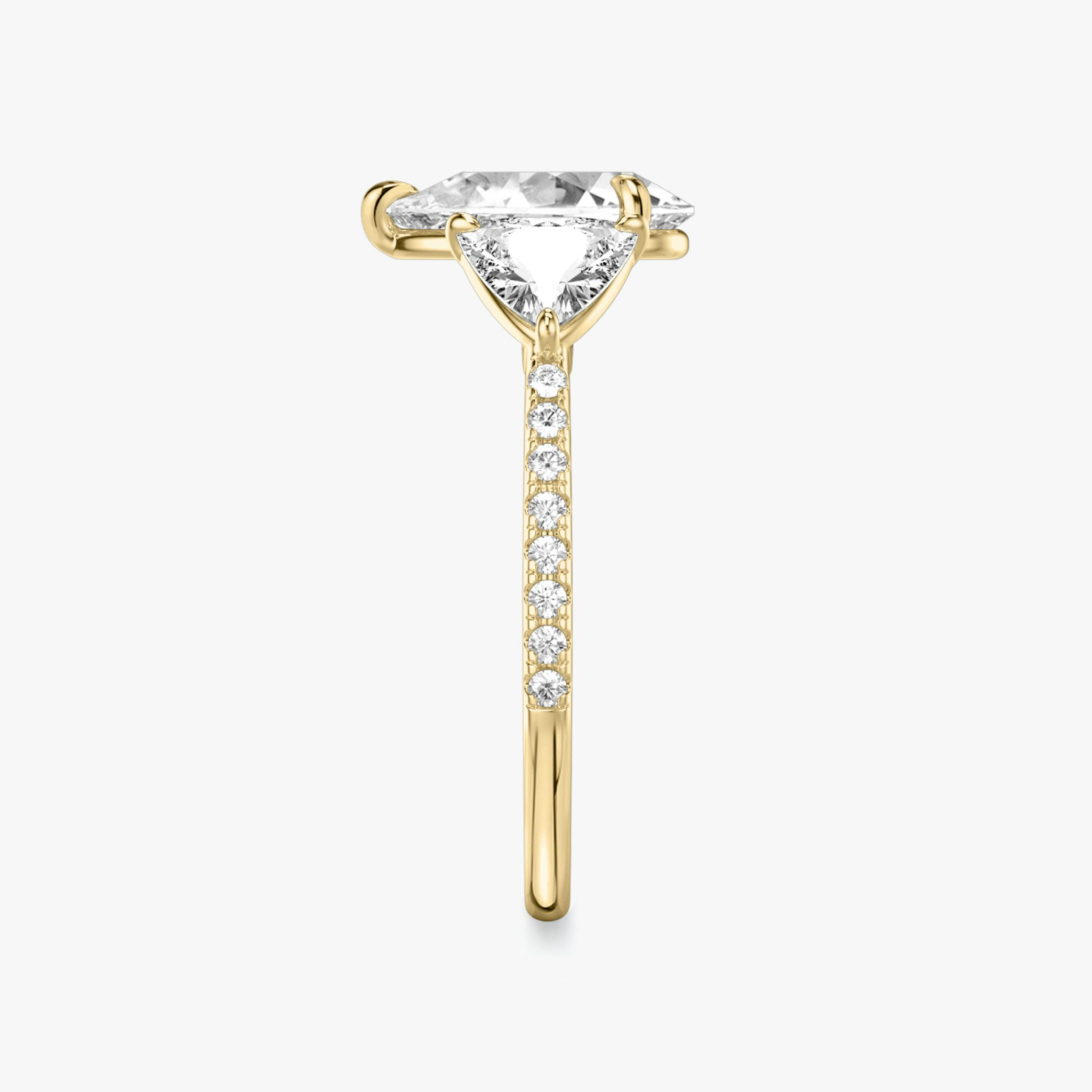The Three Stone | Pear | 18k | Yellow Gold | bandAccent: Pavé | sideStoneCarat: 0.50ct | sideStoneShape: Trillion | diamondOrientation: vertical | caratWeight: other