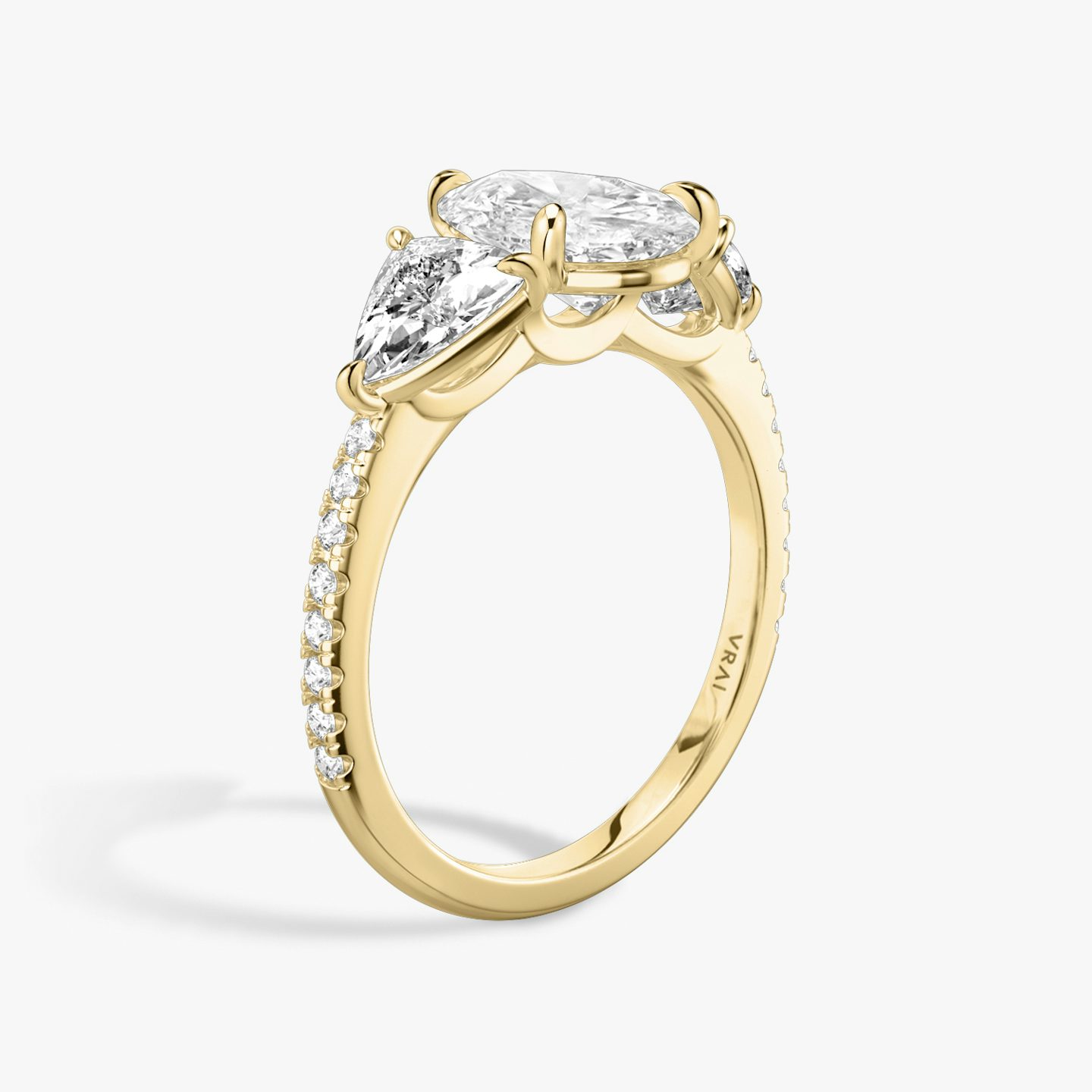 The Three Stone | Pear | 18k | Yellow Gold | bandAccent: Pavé | sideStoneCarat: 0.50ct | sideStoneShape: Trillion | diamondOrientation: vertical | caratWeight: other