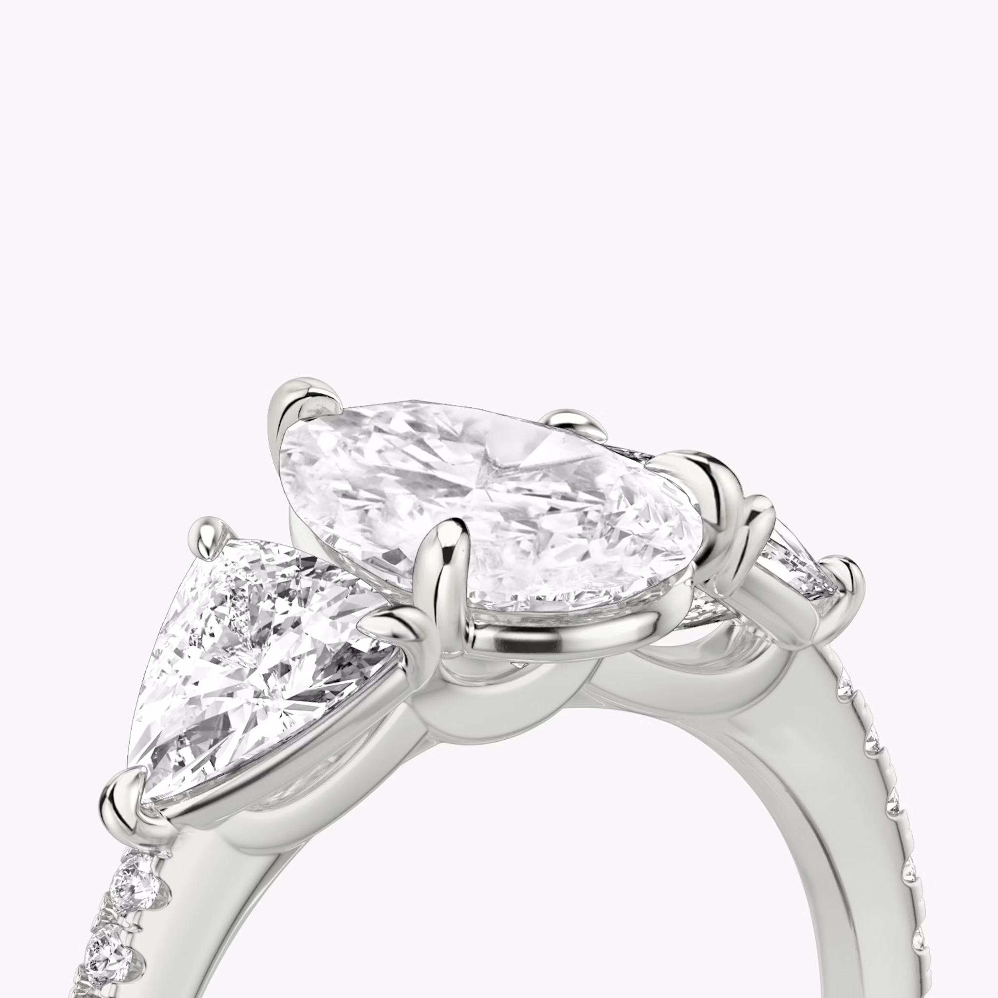 The Three Stone | Pear | 18k | White Gold | bandAccent: Pavé | sideStoneCarat: 0.50ct | sideStoneShape: Trillion | diamondOrientation: vertical | caratWeight: other
