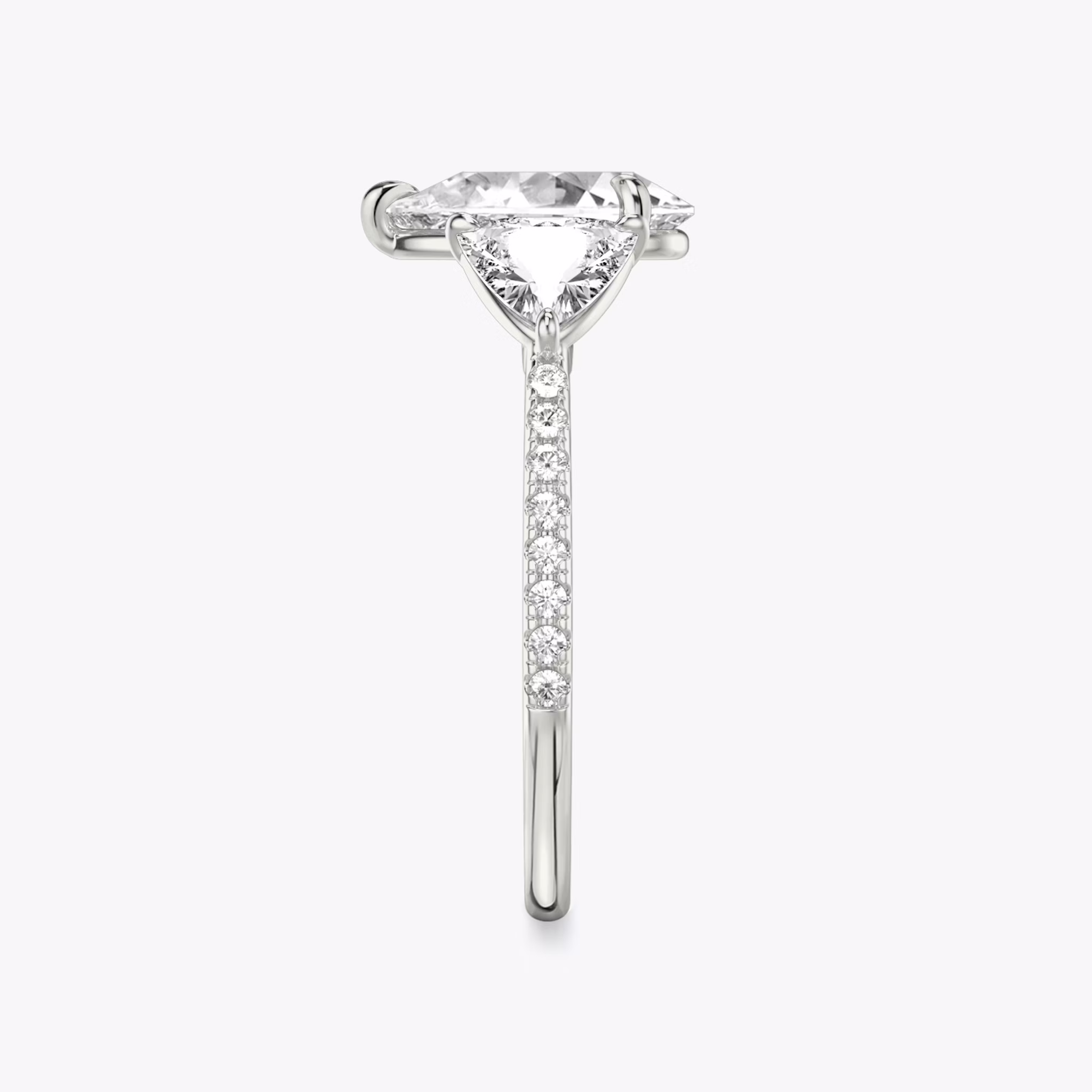 The Three Stone | Pear | 18k | White Gold | bandAccent: Pavé | sideStoneCarat: 0.50ct | sideStoneShape: Trillion | diamondOrientation: vertical | caratWeight: other