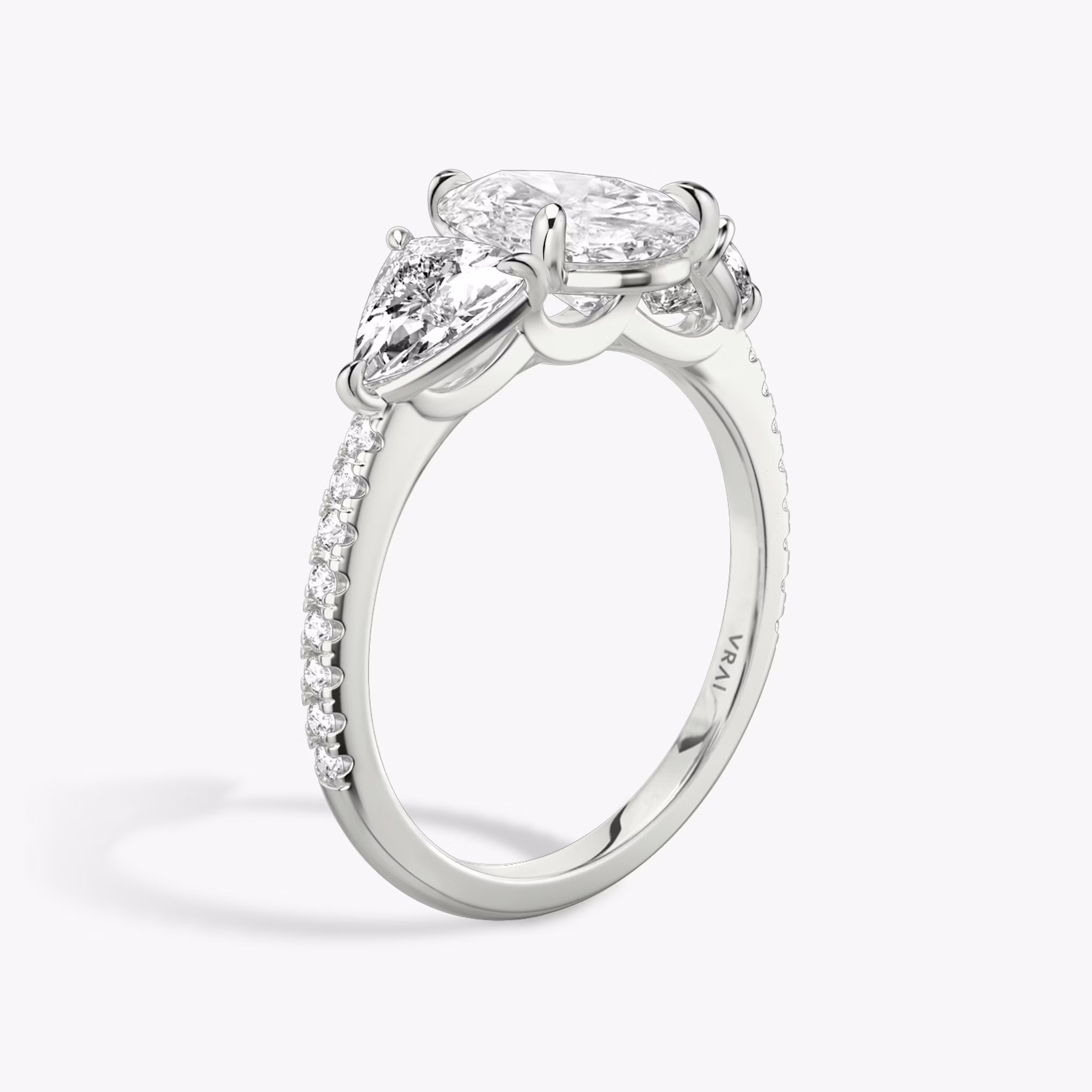The Three Stone | Pear | 18k | White Gold | bandAccent: Pavé | sideStoneCarat: 0.50ct | sideStoneShape: Trillion | diamondOrientation: vertical | caratWeight: other
