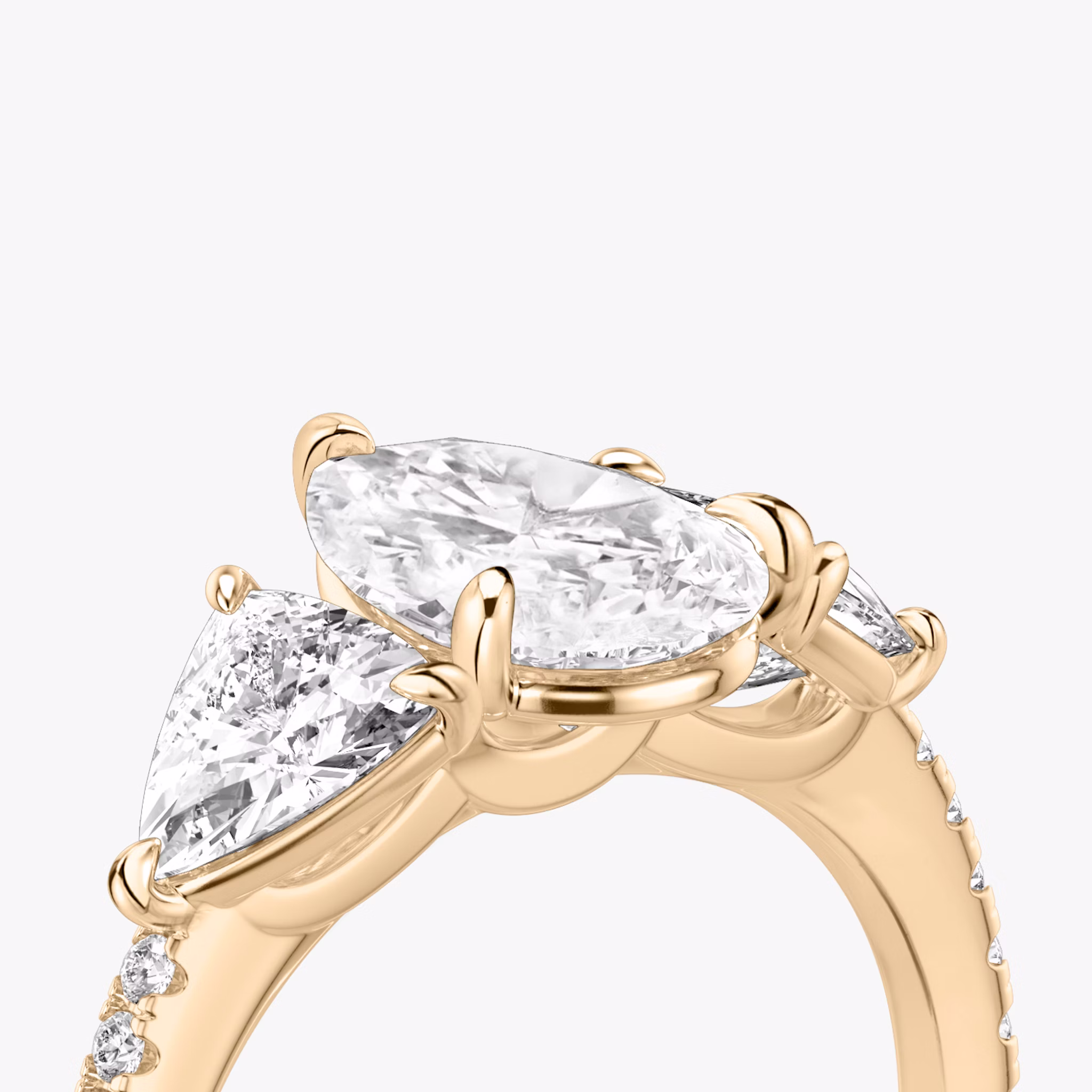 The Three Stone | Pear | 14k | Rose Gold | bandAccent: Pavé | sideStoneCarat: 0.50ct | sideStoneShape: Trillion | diamondOrientation: vertical | caratWeight: other