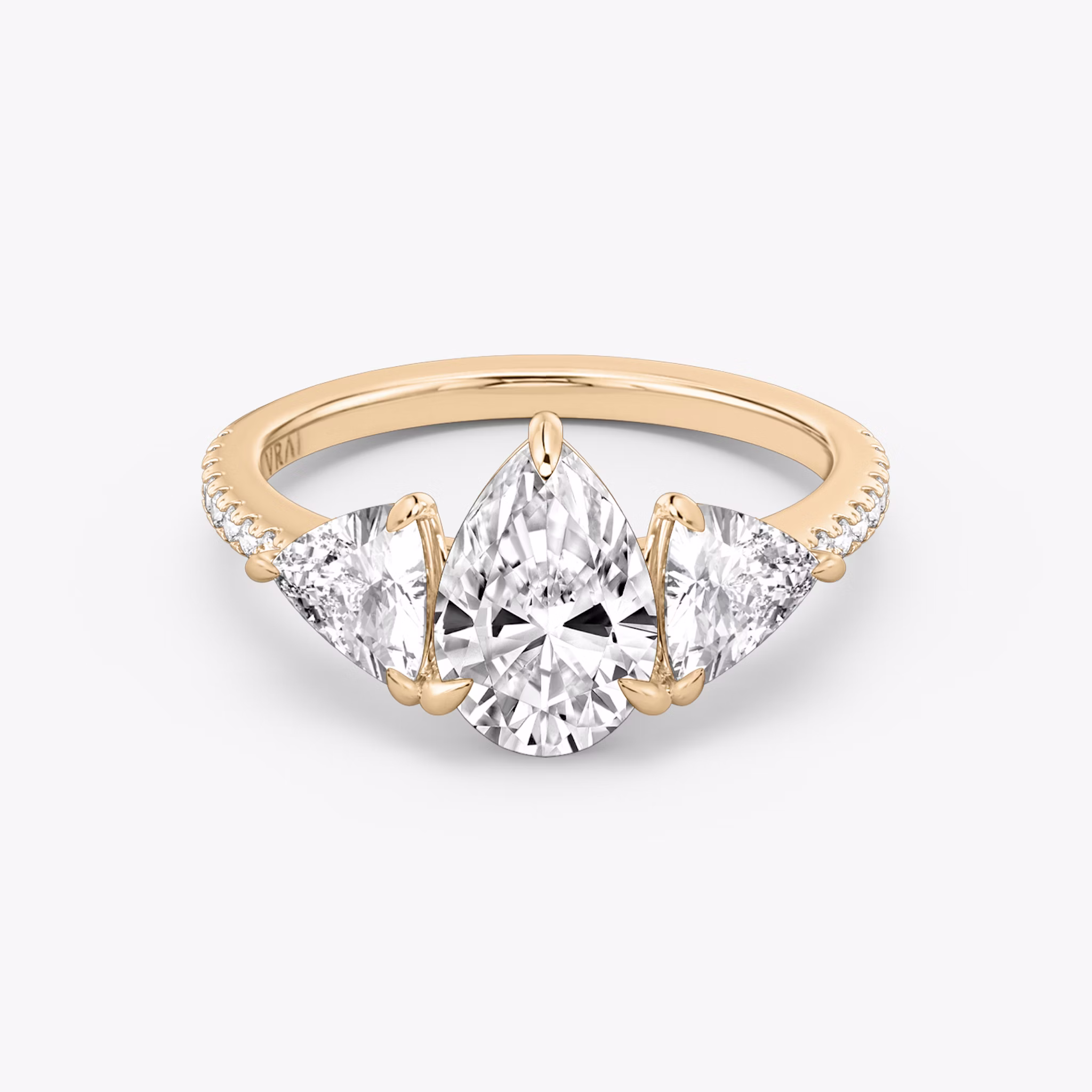 The Three Stone | Pear | 14k | Rose Gold | bandAccent: Pavé | sideStoneCarat: 0.50ct | sideStoneShape: Trillion | diamondOrientation: vertical | caratWeight: other