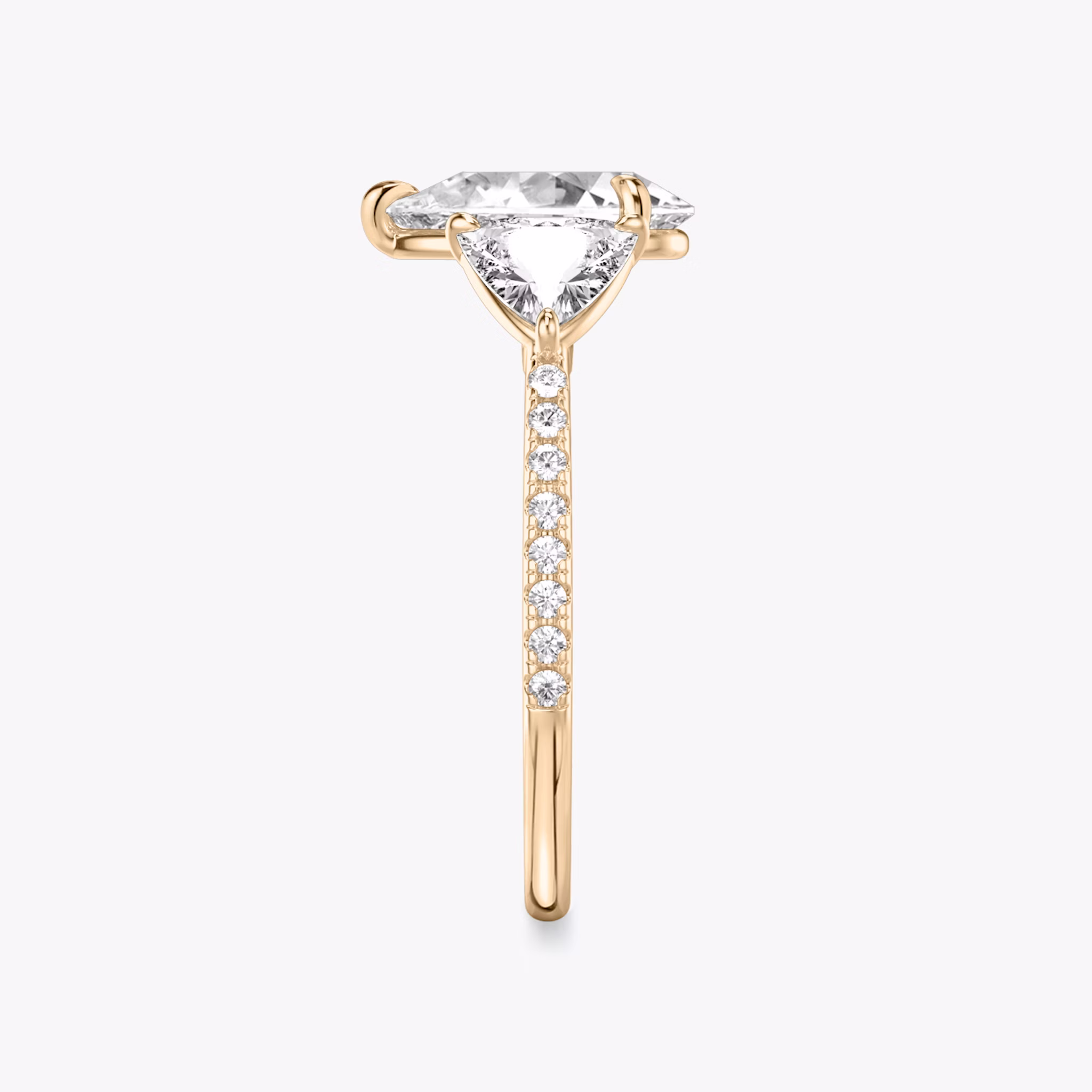 The Three Stone | Pear | 14k | Rose Gold | bandAccent: Pavé | sideStoneCarat: 0.50ct | sideStoneShape: Trillion | diamondOrientation: vertical | caratWeight: other