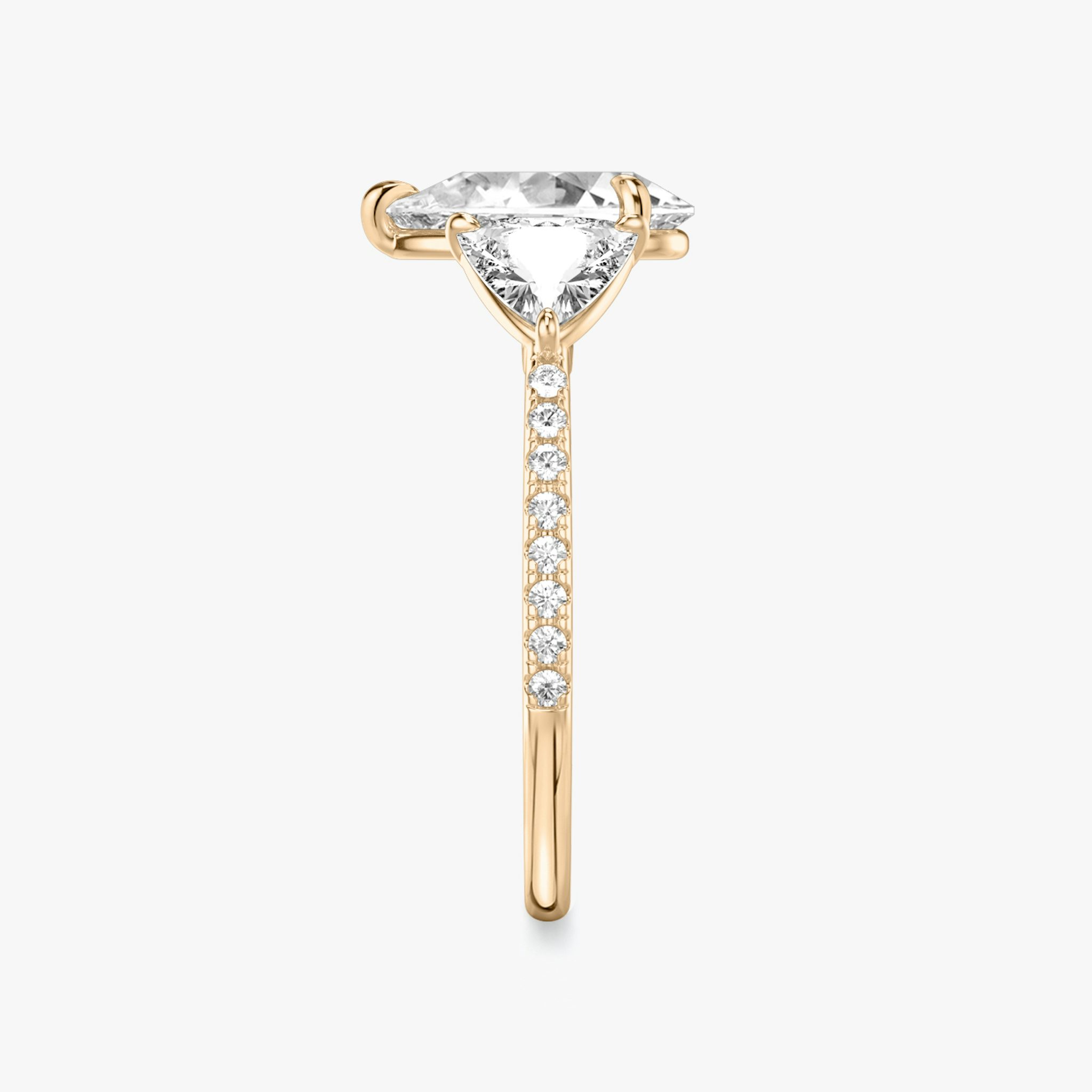 The Three Stone | Pear | 14k | Rose Gold | bandAccent: Pavé | sideStoneCarat: 0.50ct | sideStoneShape: Trillion | diamondOrientation: vertical | caratWeight: other