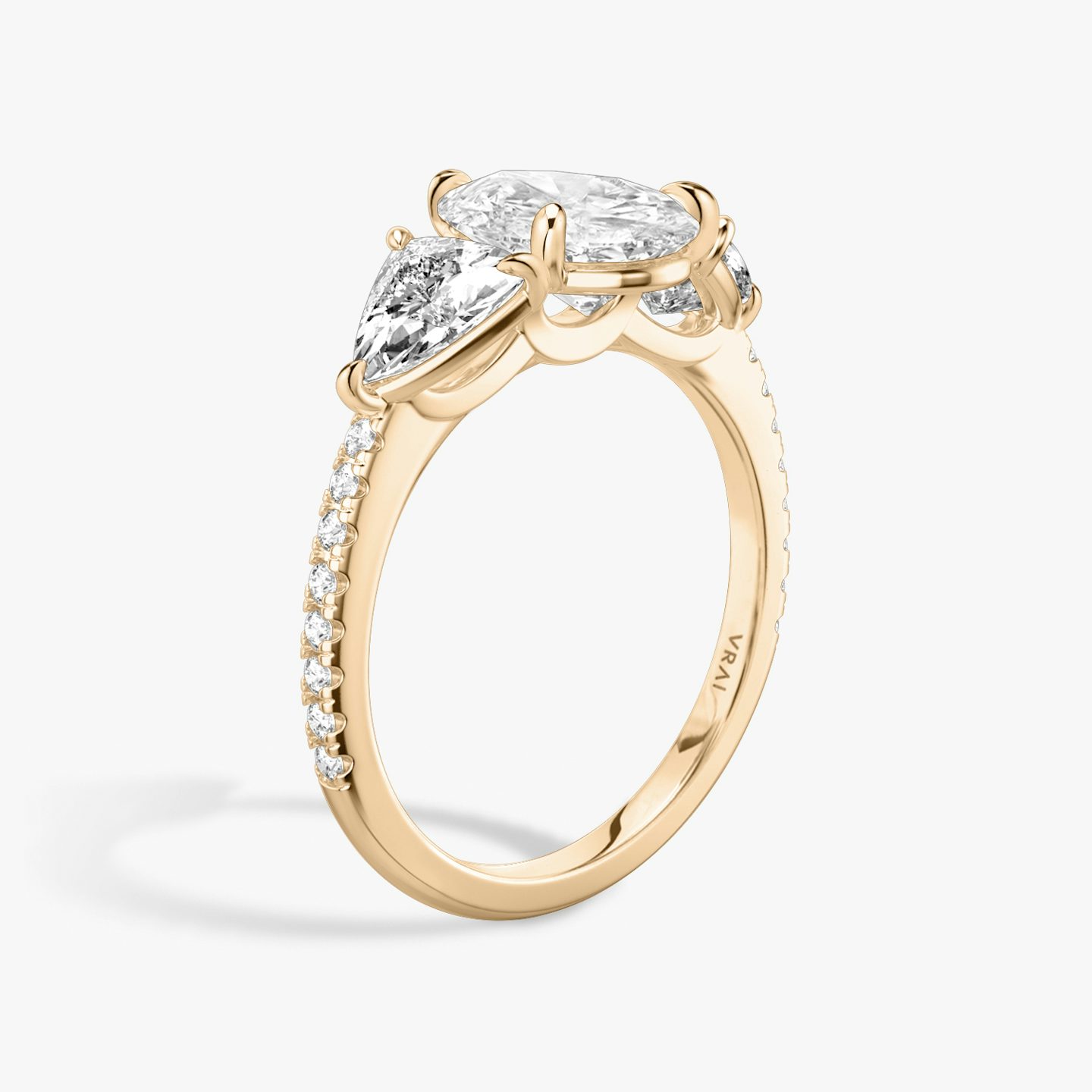 The Three Stone | Pear | 14k | Rose Gold | bandAccent: Pavé | sideStoneCarat: 0.50ct | sideStoneShape: Trillion | diamondOrientation: vertical | caratWeight: other