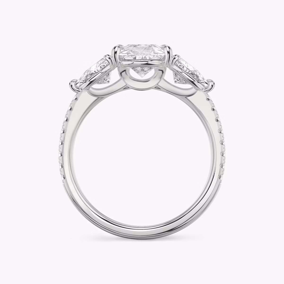 The Three Stone | Pear | Platinum | bandAccent: Pavé | sideStoneCarat: 0.50ct | sideStoneShape: Trillion | diamondOrientation: vertical | caratWeight: other