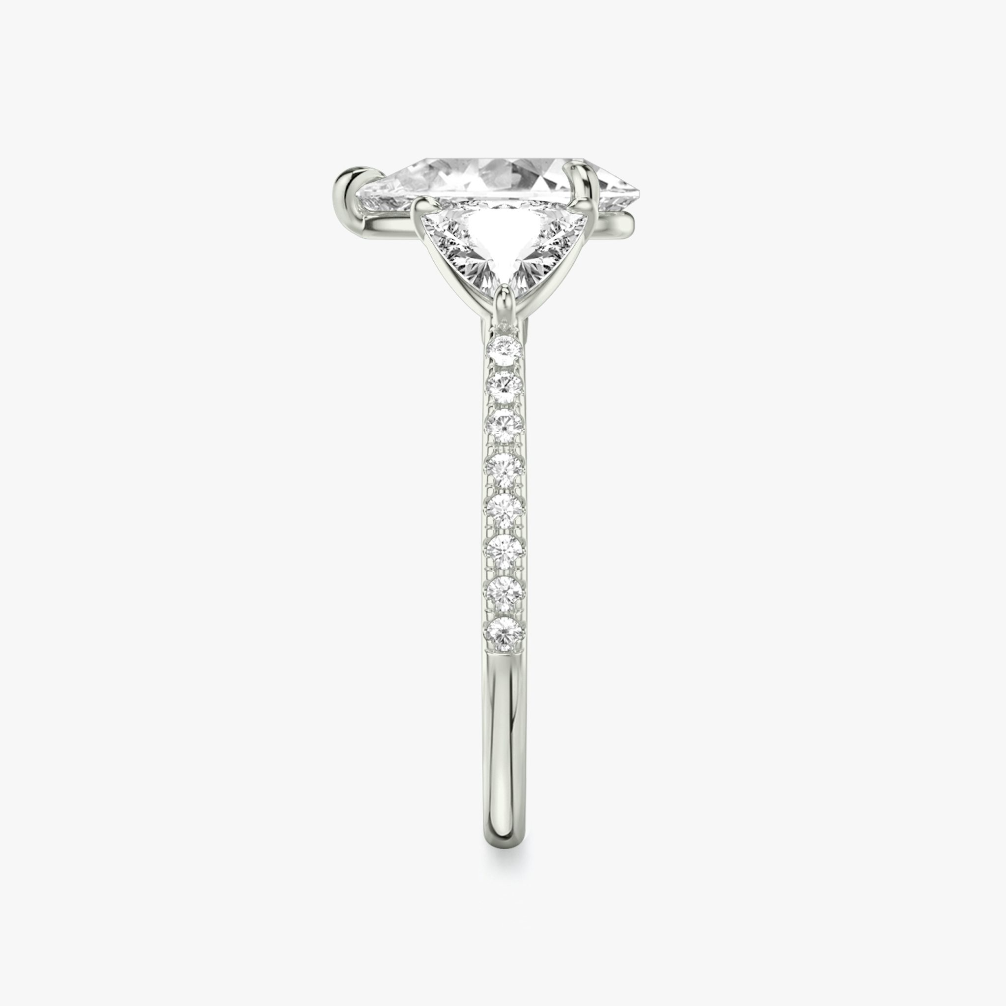 The Three Stone | Pear | Platinum | bandAccent: Pavé | sideStoneCarat: 0.50ct | sideStoneShape: Trillion | diamondOrientation: vertical | caratWeight: other