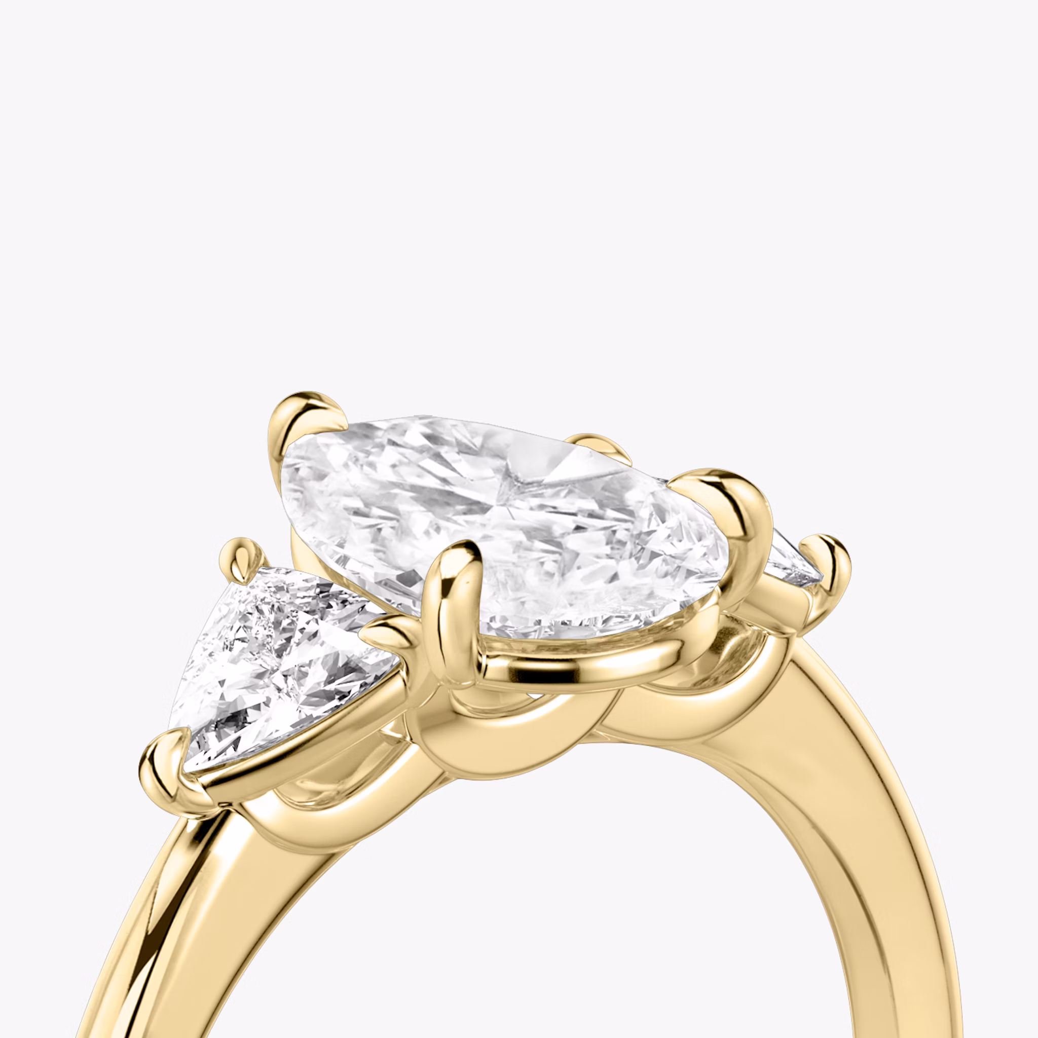 The Three Stone | Pear | 18k | Yellow Gold | bandAccent: Plain | sideStoneCarat: 0.25ct | sideStoneShape: Trillion | diamondOrientation: vertical | caratWeight: other