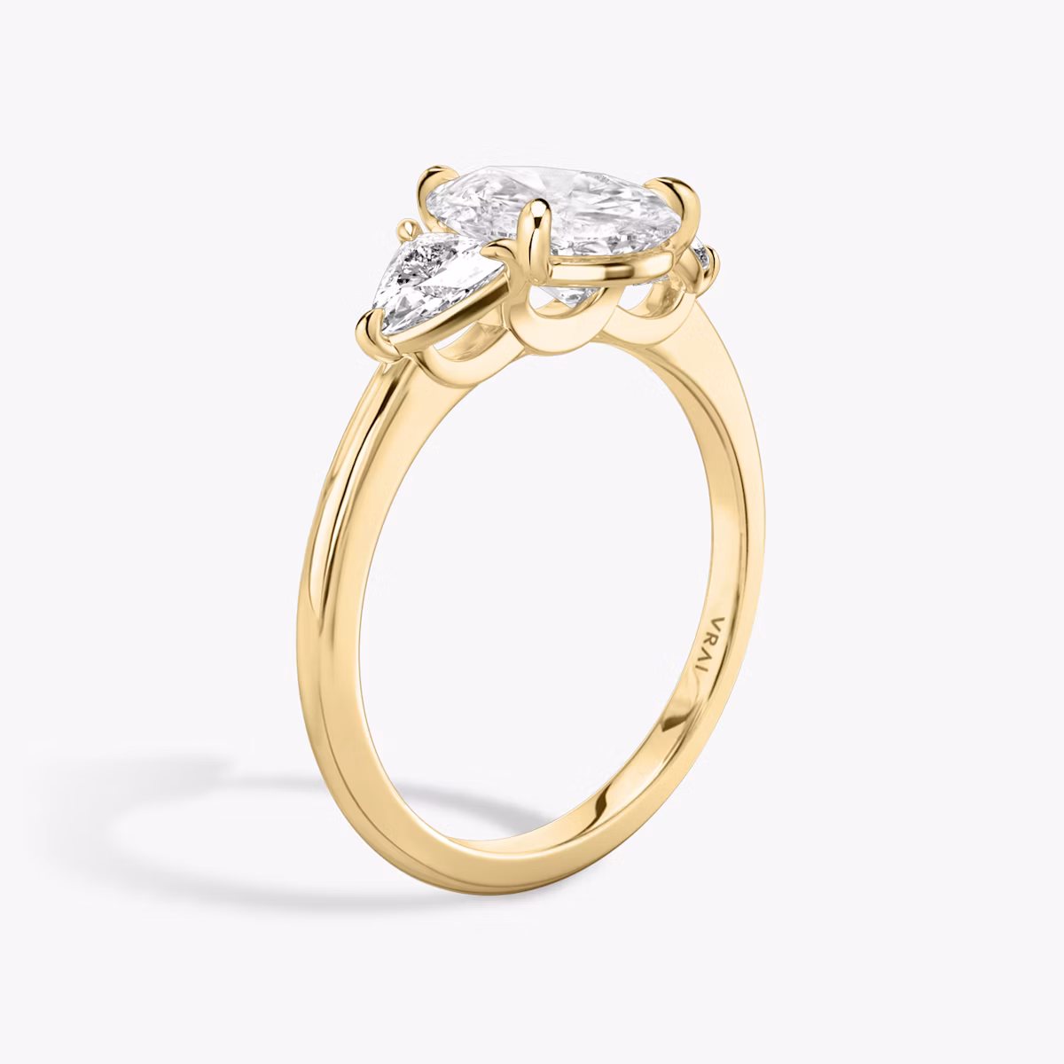 The Three Stone | Pear | 18k | Yellow Gold | bandAccent: Plain | sideStoneCarat: 0.25ct | sideStoneShape: Trillion | diamondOrientation: vertical | caratWeight: other