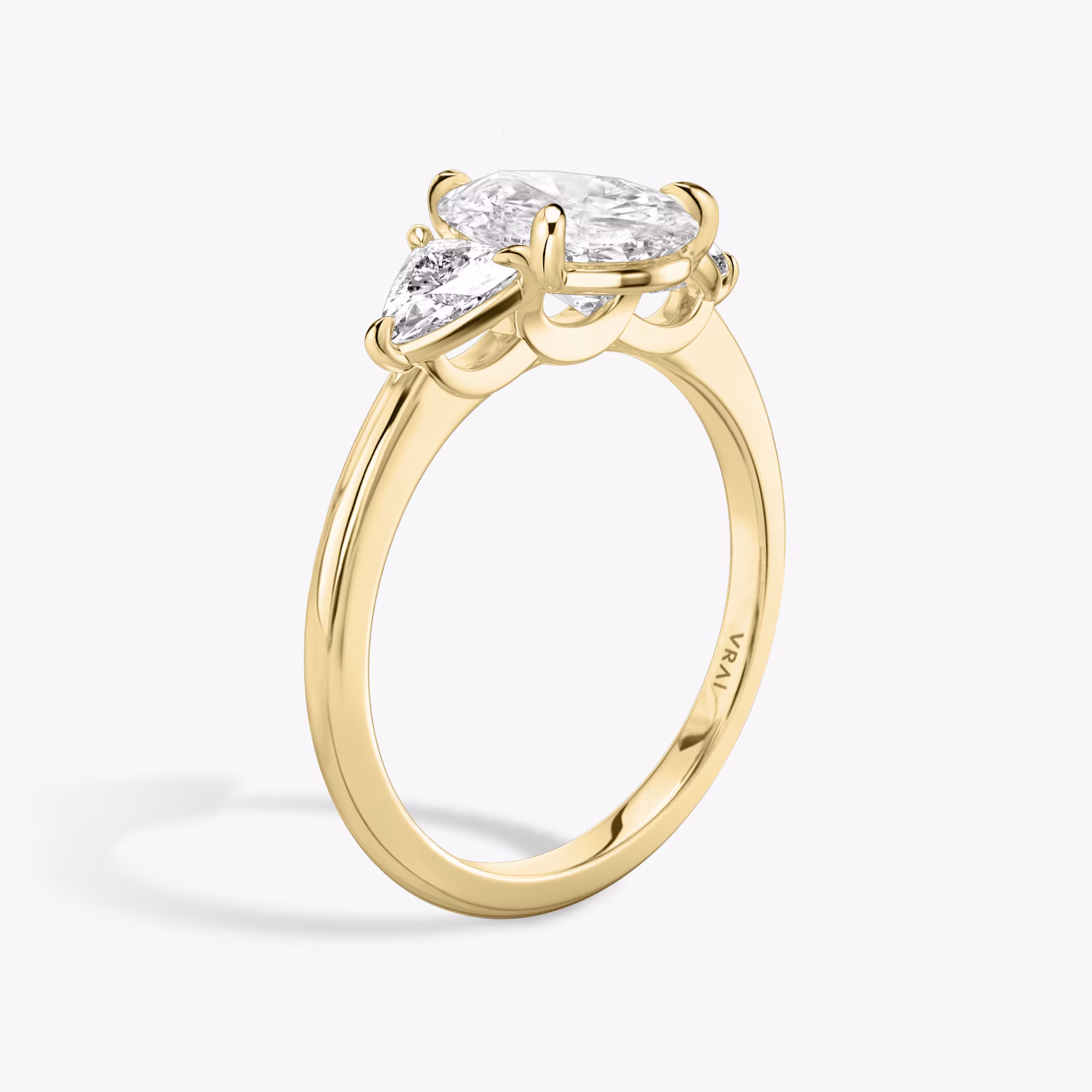 The Three Stone | Pear | 18k | Yellow Gold | bandAccent: Plain | sideStoneCarat: 0.25ct | sideStoneShape: Trillion | diamondOrientation: vertical | caratWeight: other