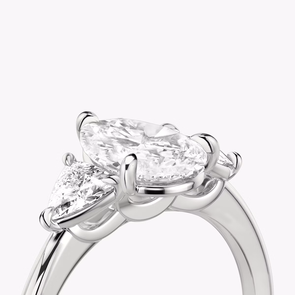 The Three Stone | Pear | 18k | White Gold | bandAccent: Plain | sideStoneCarat: 0.25ct | sideStoneShape: Trillion | diamondOrientation: vertical | caratWeight: other
