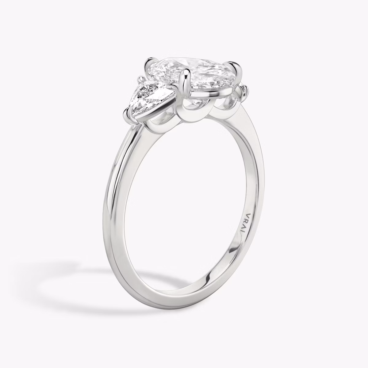 The Three Stone | Pear | 18k | White Gold | bandAccent: Plain | sideStoneCarat: 0.25ct | sideStoneShape: Trillion | diamondOrientation: vertical | caratWeight: other