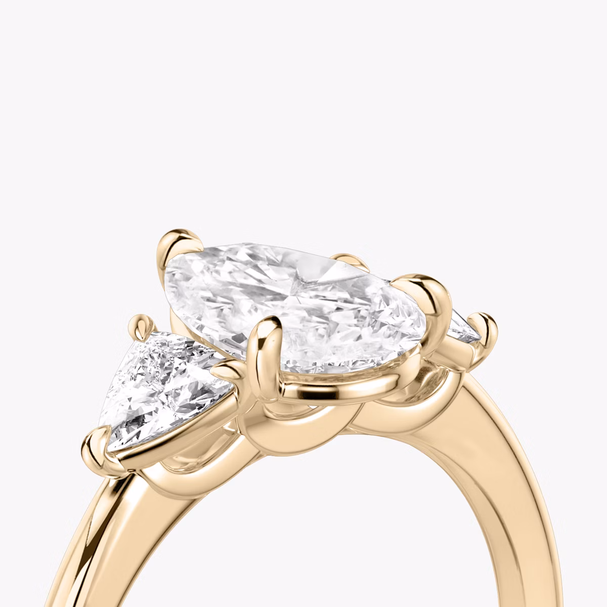 The Three Stone | Pear | 14k | Rose Gold | bandAccent: Plain | sideStoneCarat: 0.25ct | sideStoneShape: Trillion | diamondOrientation: vertical | caratWeight: other