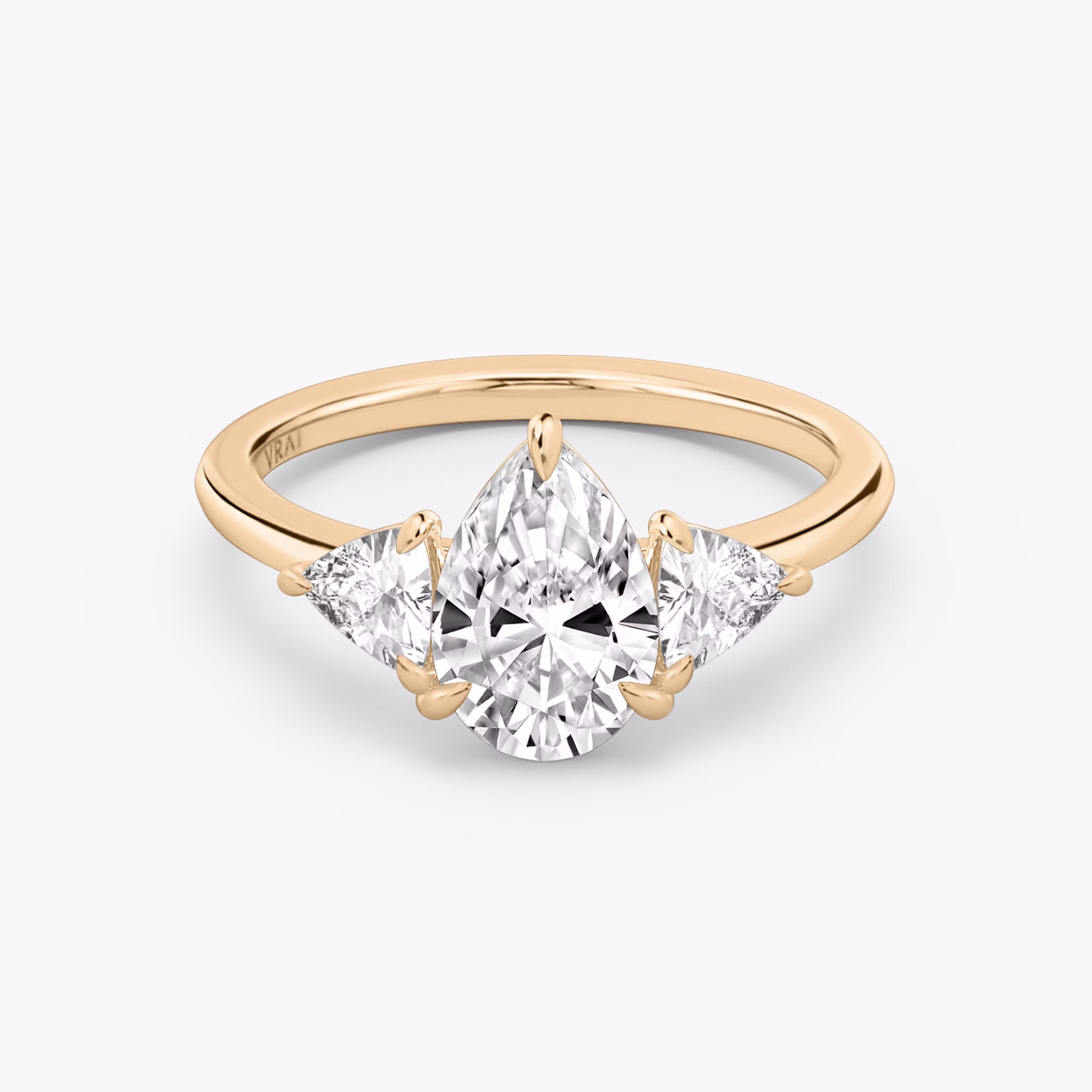 The Three Stone | Pear | 14k | Rose Gold | bandAccent: Plain | sideStoneCarat: 0.25ct | sideStoneShape: Trillion | diamondOrientation: vertical | caratWeight: other