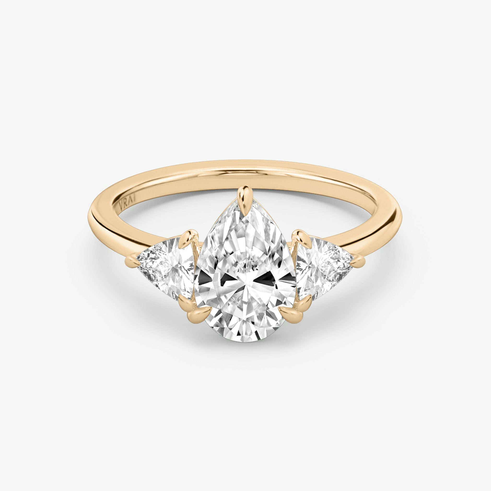 The Three Stone | Pear | 14k | Rose Gold | bandAccent: Plain | sideStoneCarat: 0.25ct | sideStoneShape: Trillion | diamondOrientation: vertical | caratWeight: other