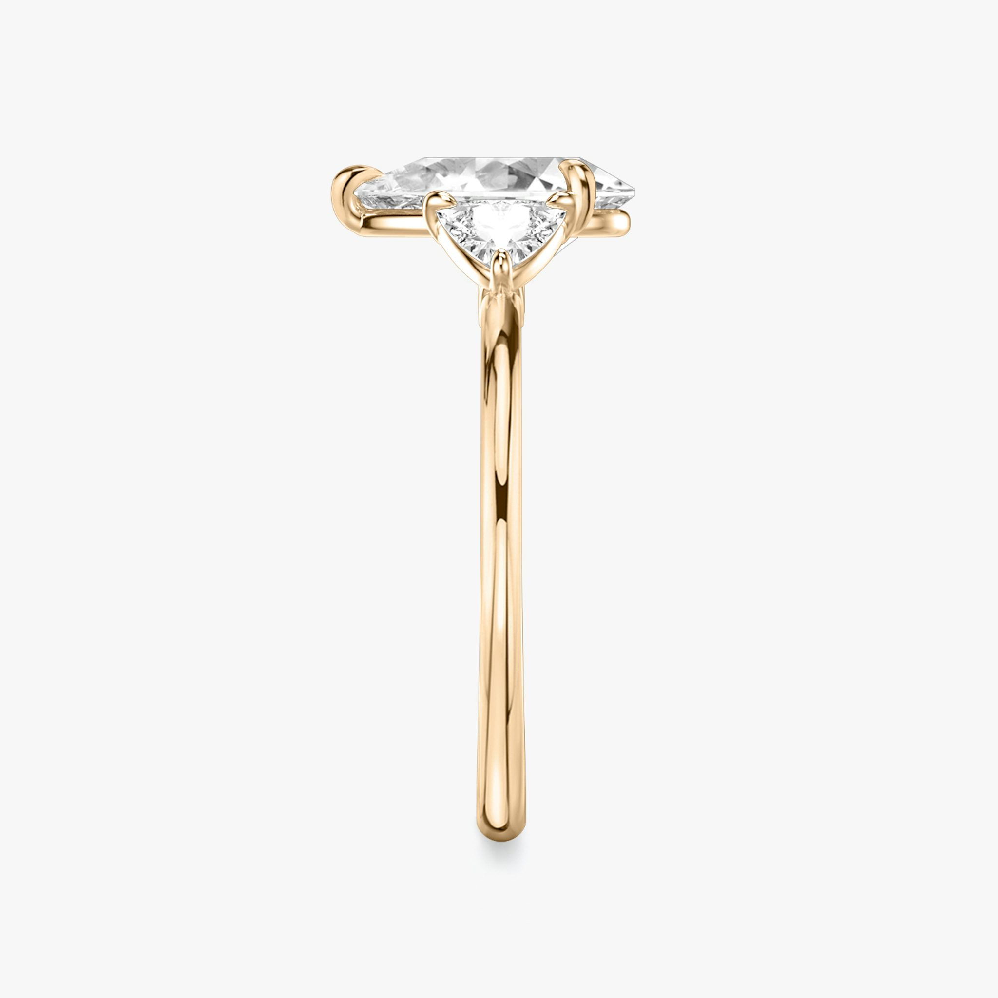 The Three Stone | Pear | 14k | Rose Gold | bandAccent: Plain | sideStoneCarat: 0.25ct | sideStoneShape: Trillion | diamondOrientation: vertical | caratWeight: other