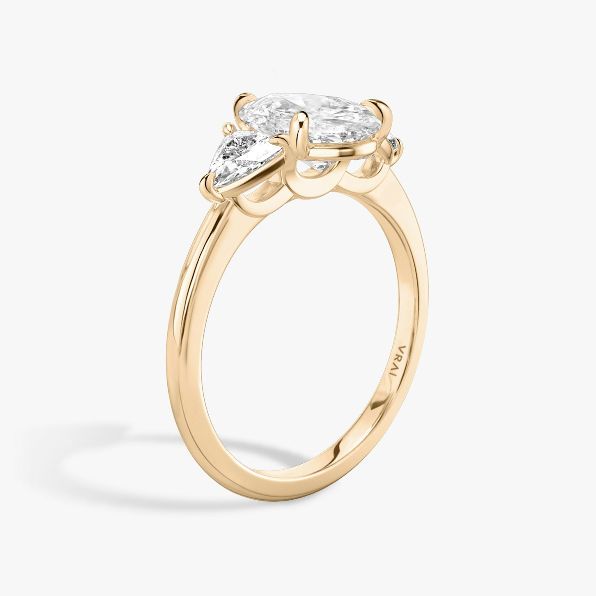 The Three Stone | Pear | 14k | Rose Gold | bandAccent: Plain | sideStoneCarat: 0.25ct | sideStoneShape: Trillion | diamondOrientation: vertical | caratWeight: other