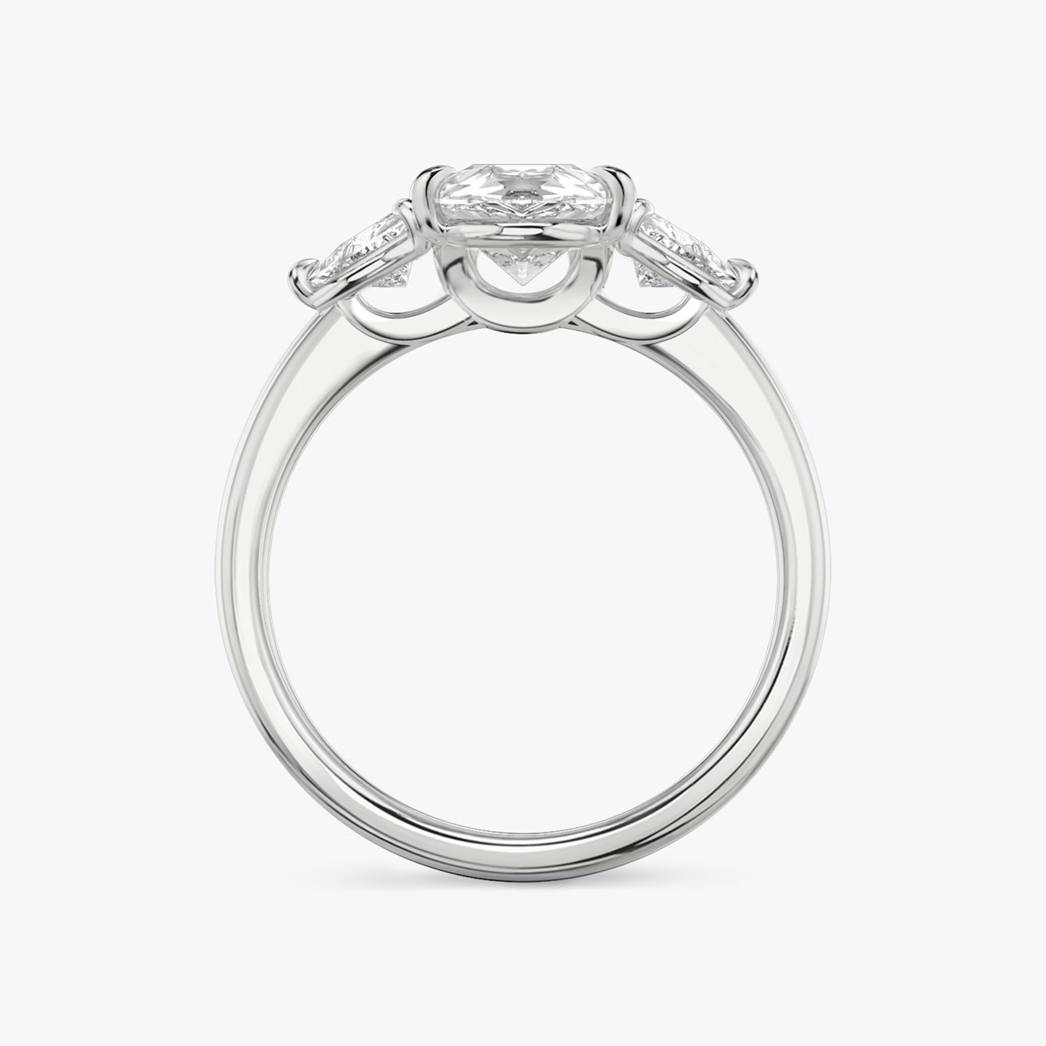 The Three Stone | Pear | Platinum | bandAccent: Plain | sideStoneCarat: 0.25ct | sideStoneShape: Trillion | diamondOrientation: vertical | caratWeight: other