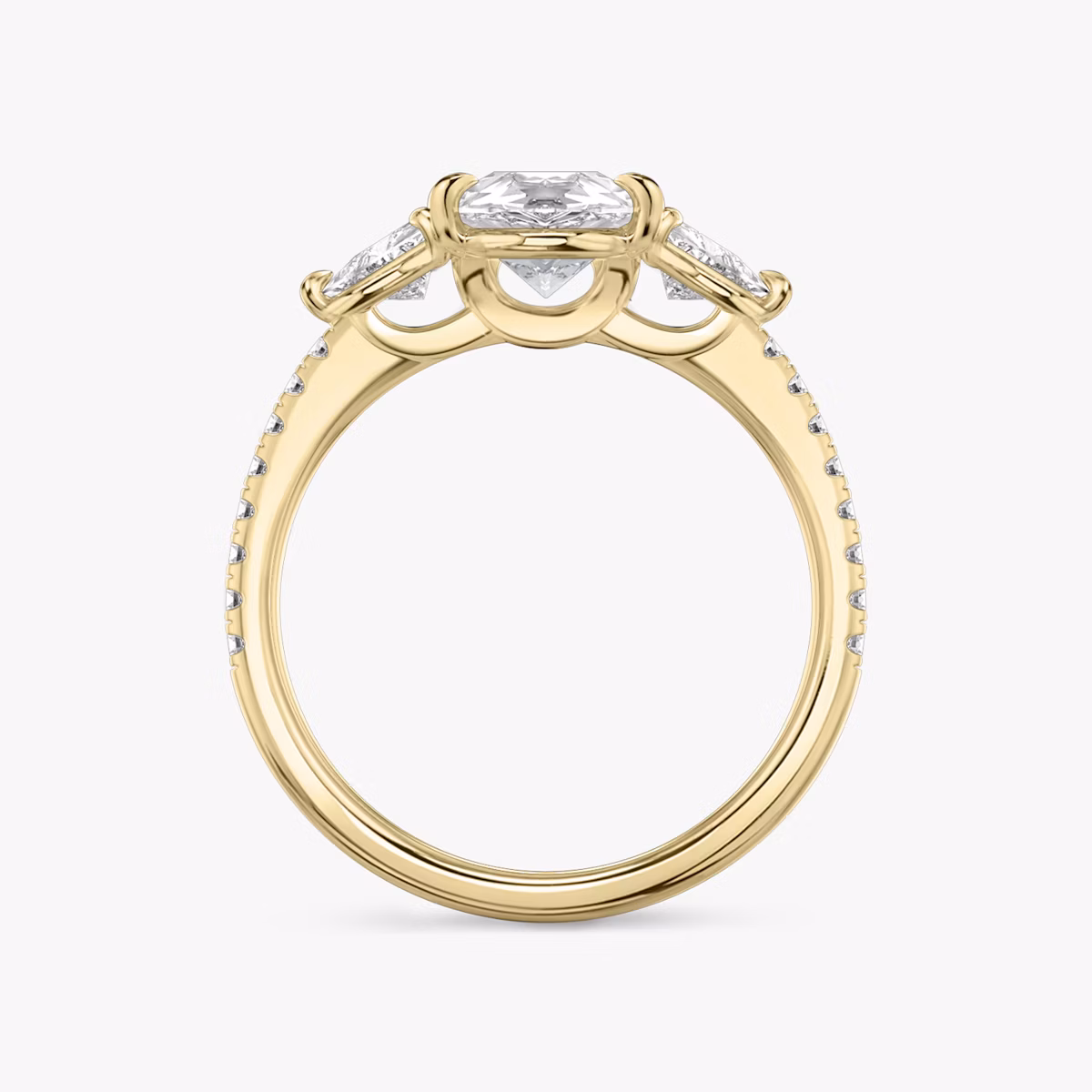 The Three Stone | Pear | 18k | Yellow Gold | bandAccent: Pavé | sideStoneCarat: 0.25ct | sideStoneShape: Trillion | diamondOrientation: vertical | caratWeight: other