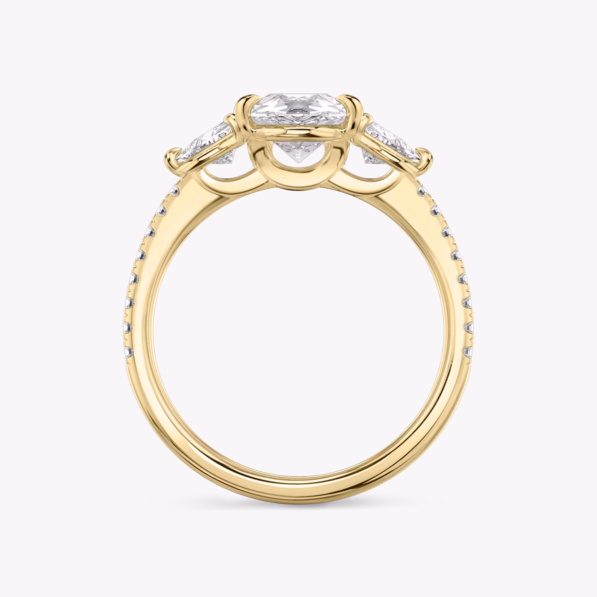 The Three Stone | Pear | 18k | Yellow Gold | bandAccent: Pavé | sideStoneCarat: 0.25ct | sideStoneShape: Trillion | diamondOrientation: vertical | caratWeight: other