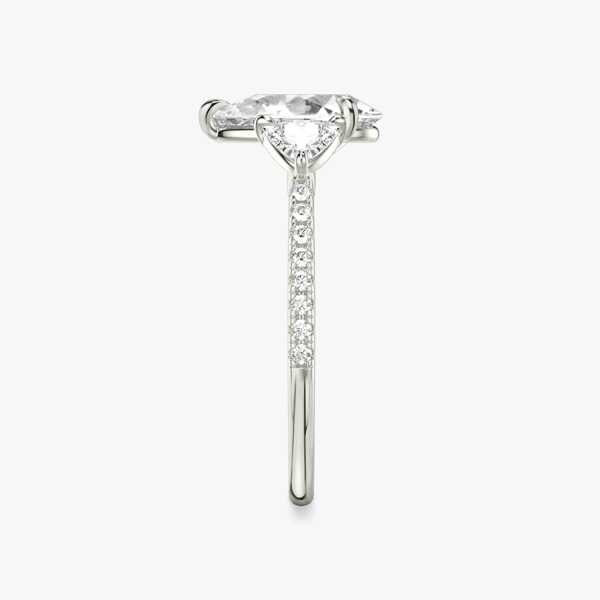 The Three Stone | Pear | 18k | White Gold | bandAccent: Pavé | sideStoneCarat: 0.25ct | sideStoneShape: Trillion | diamondOrientation: vertical | caratWeight: other
