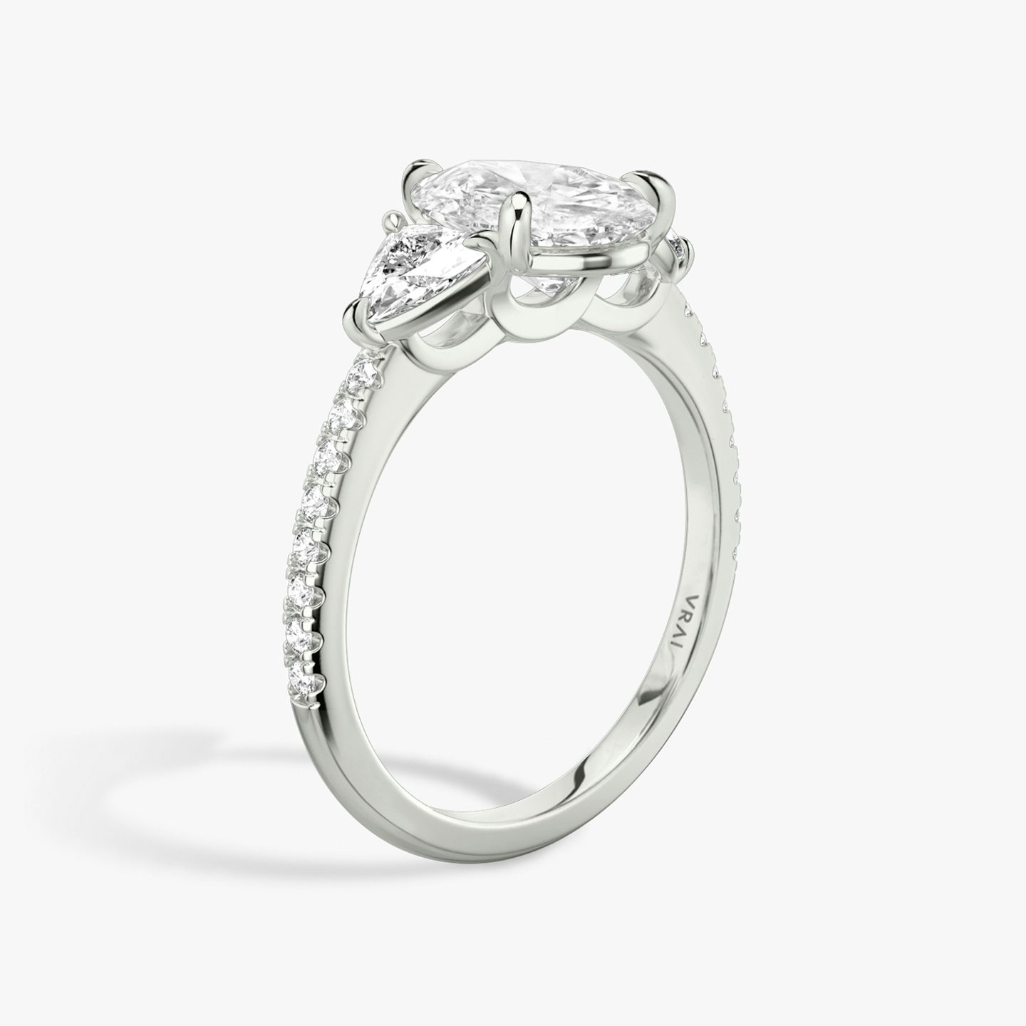 The Three Stone | Pear | 18k | White Gold | bandAccent: Pavé | sideStoneCarat: 0.25ct | sideStoneShape: Trillion | diamondOrientation: vertical | caratWeight: other