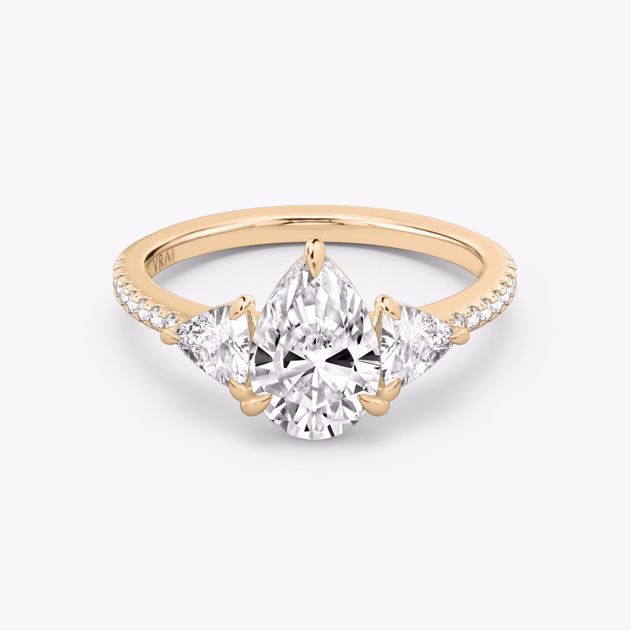 The Three Stone | Pear | 14k | Rose Gold | bandAccent: Pavé | sideStoneCarat: 0.25ct | sideStoneShape: Trillion | diamondOrientation: vertical | caratWeight: other