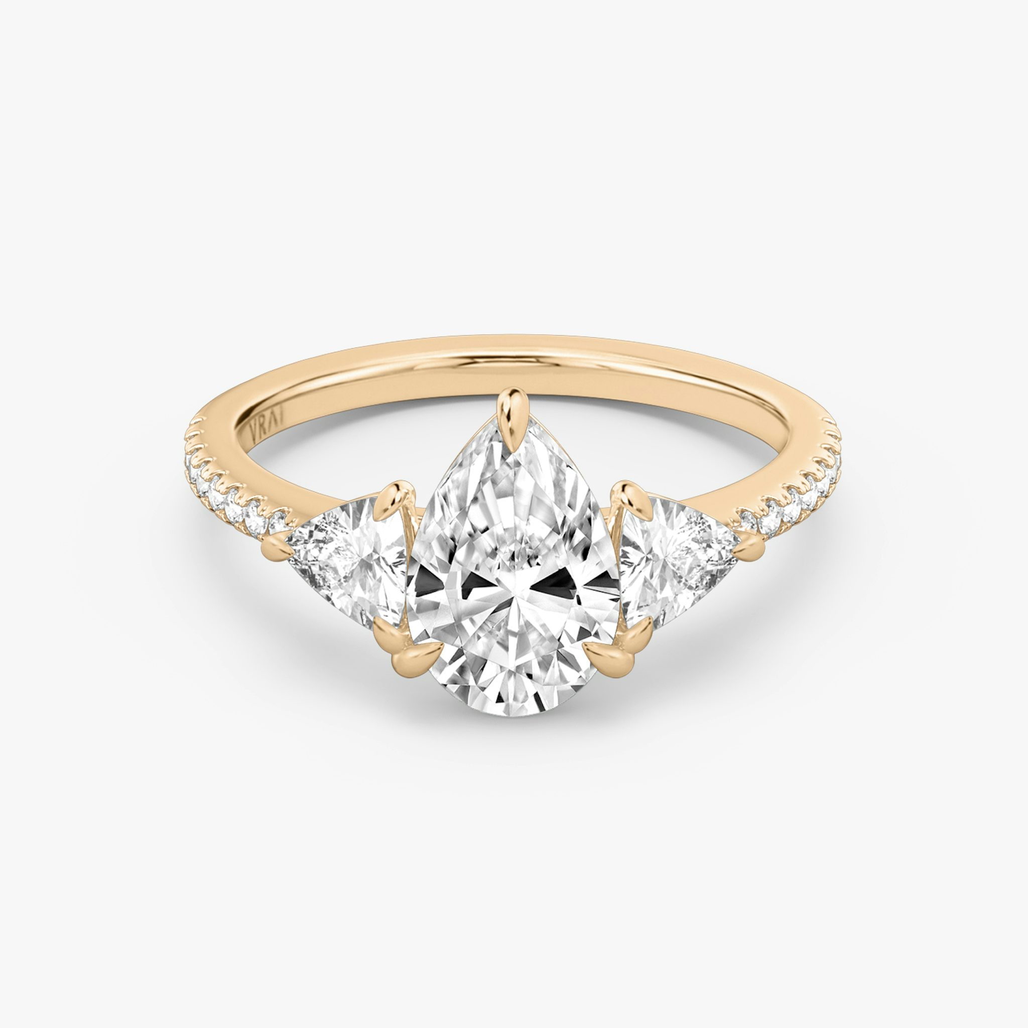 The Three Stone | Pear | 14k | Rose Gold | bandAccent: Pavé | sideStoneCarat: 0.25ct | sideStoneShape: Trillion | diamondOrientation: vertical | caratWeight: other