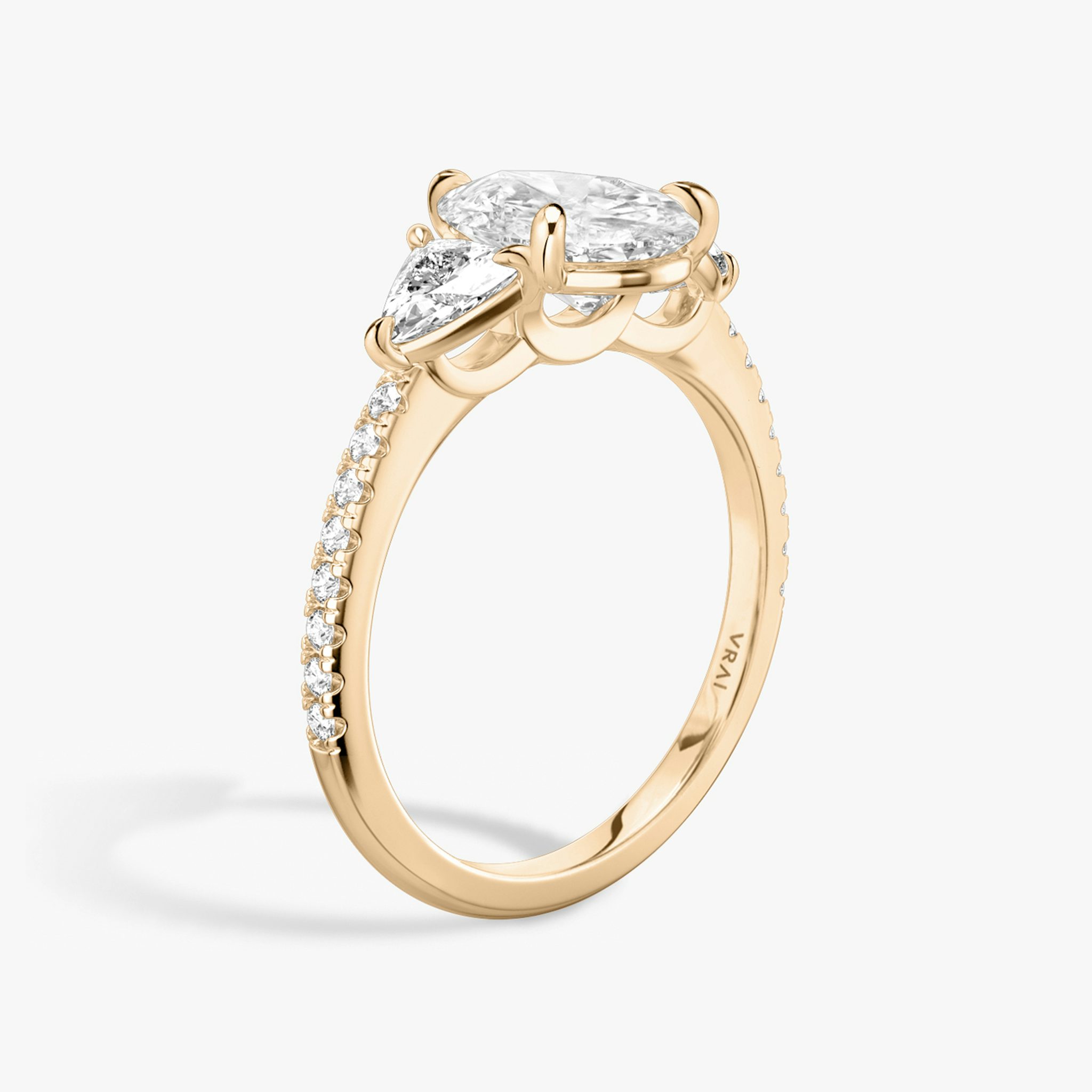 The Three Stone | Pear | 14k | Rose Gold | bandAccent: Pavé | sideStoneCarat: 0.25ct | sideStoneShape: Trillion | diamondOrientation: vertical | caratWeight: other