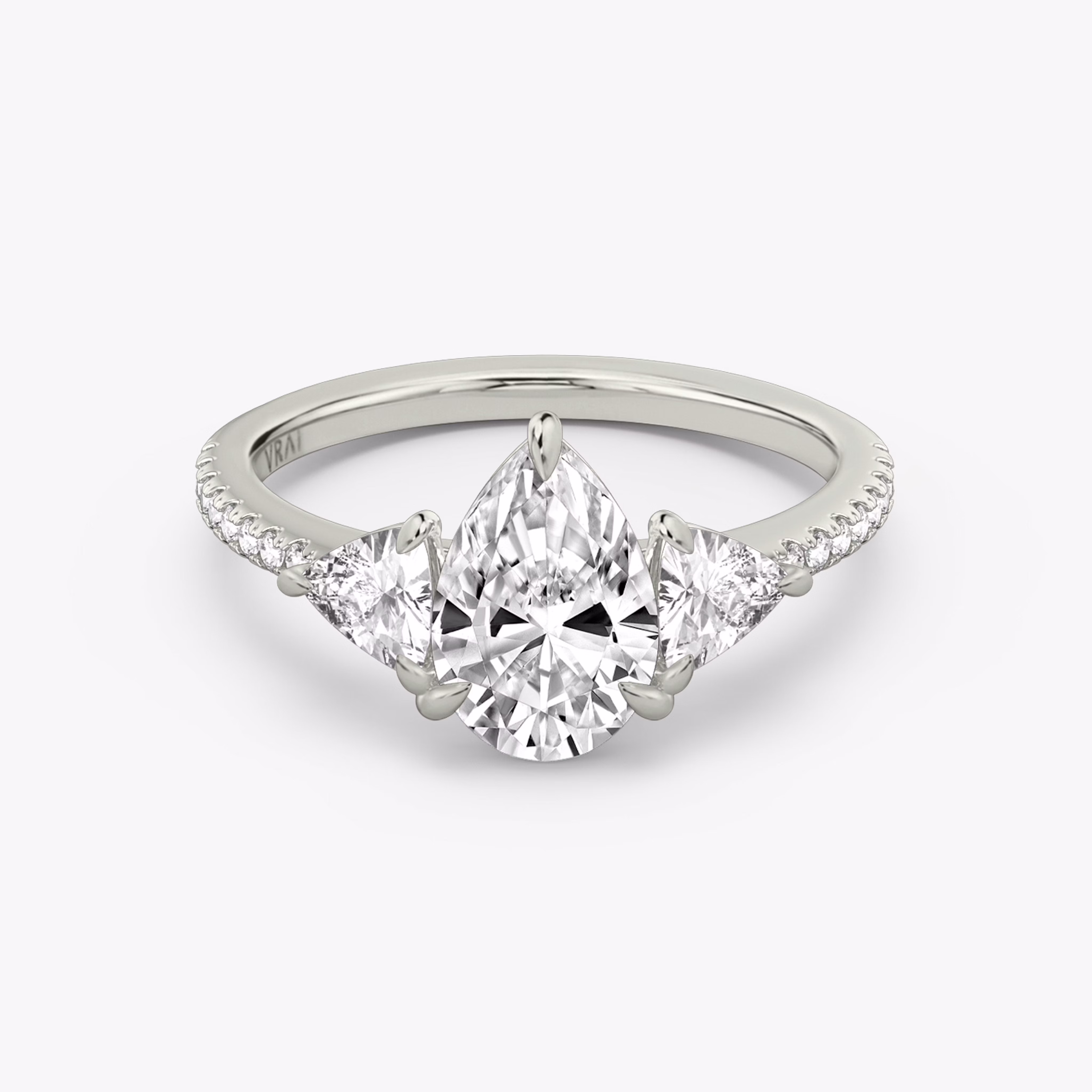 The Three Stone with Pear and Trillion VRAI created diamonds