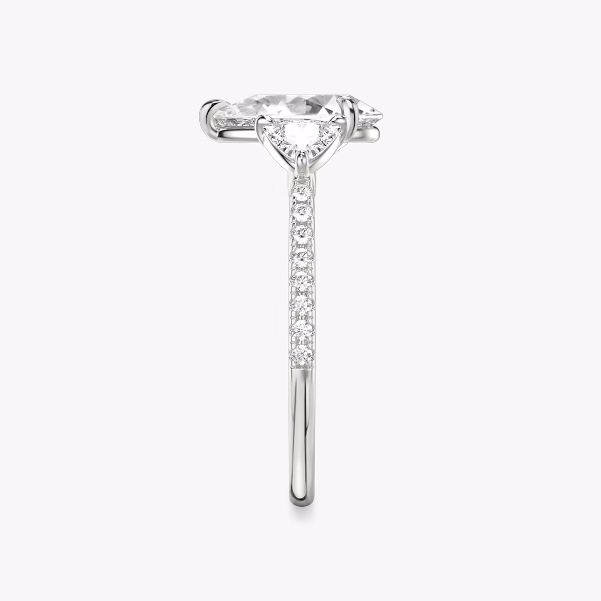 The Three Stone | Pear | Platinum | bandAccent: Pavé | sideStoneCarat: 0.25ct | sideStoneShape: Trillion | diamondOrientation: vertical | caratWeight: other