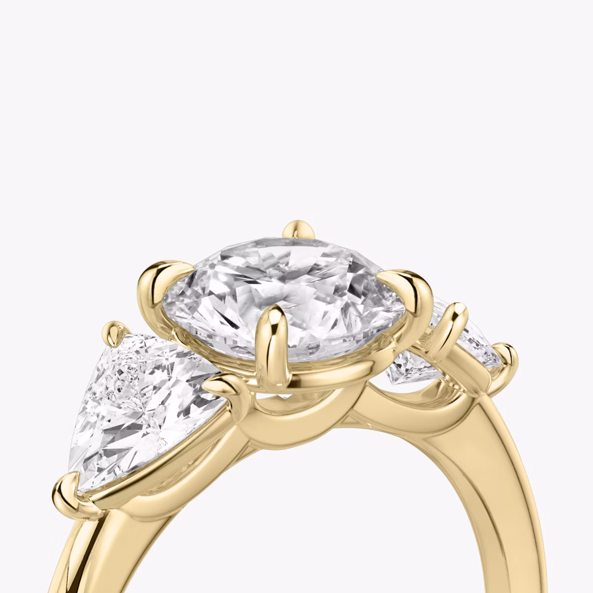 The Three Stone | Round Brilliant | 18k | Yellow Gold | bandAccent: Plain | caratWeight: other | sideStoneCarat: 0.50ct | sideStoneShape: Trillion | diamondOrientation: vertical