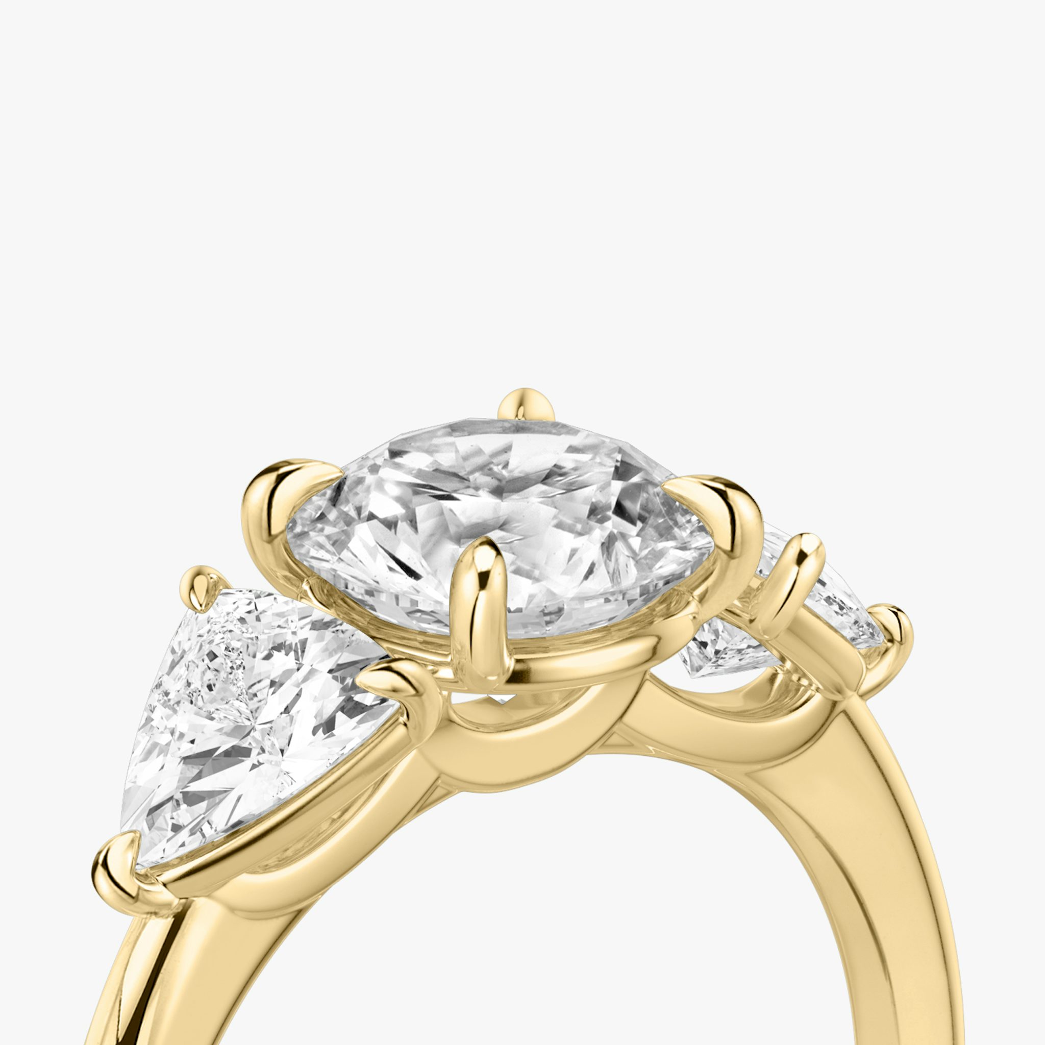 The Three Stone | Round Brilliant | 18k | Yellow Gold | bandAccent: Plain | caratWeight: other | sideStoneCarat: 0.50ct | sideStoneShape: Trillion | diamondOrientation: vertical