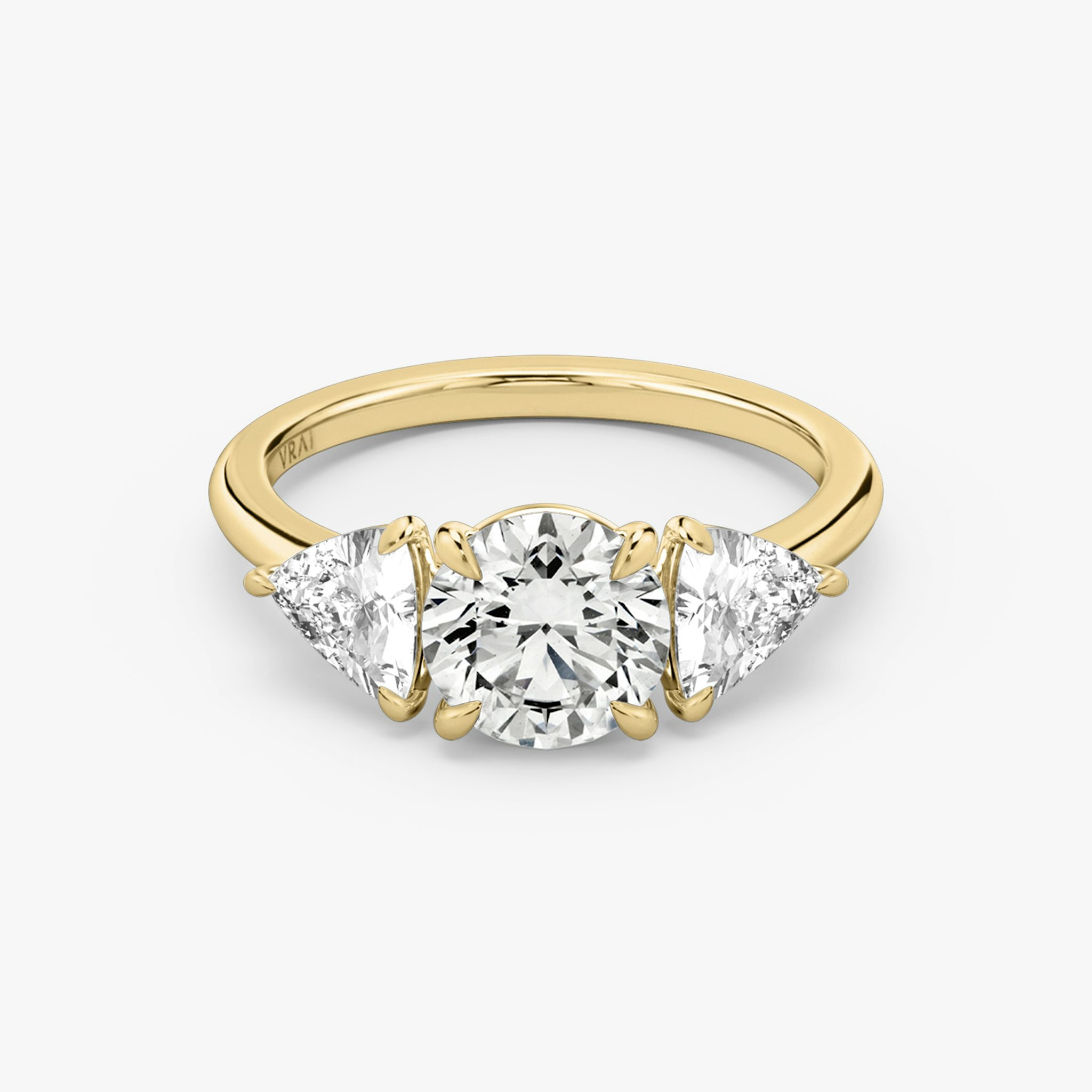 The Three Stone | Round Brilliant | 18k | Yellow Gold | bandAccent: Plain | caratWeight: other | sideStoneCarat: 0.50ct | sideStoneShape: Trillion | diamondOrientation: vertical