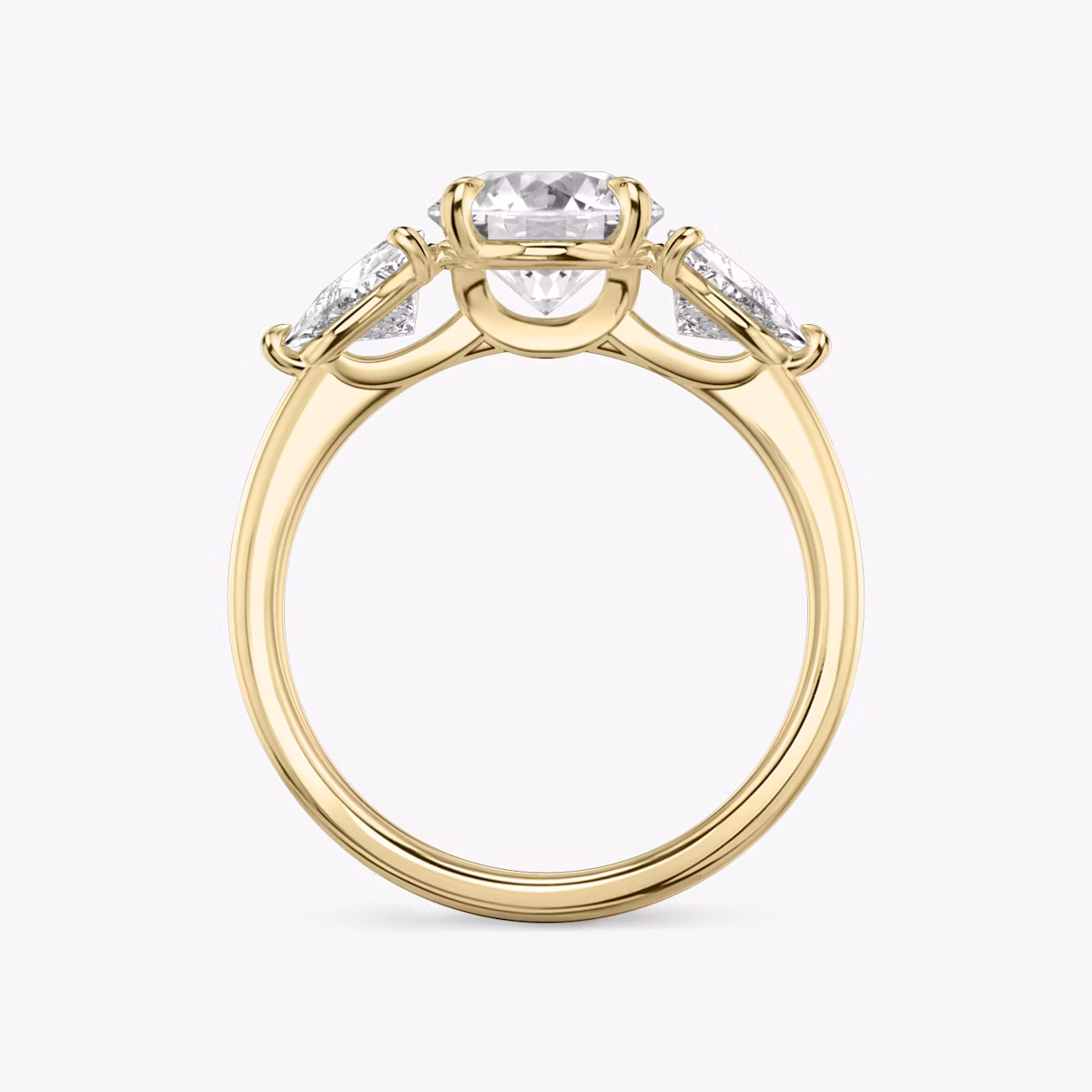 The Three Stone | Round Brilliant | 18k | Yellow Gold | bandAccent: Plain | caratWeight: other | sideStoneCarat: 0.50ct | sideStoneShape: Trillion | diamondOrientation: vertical