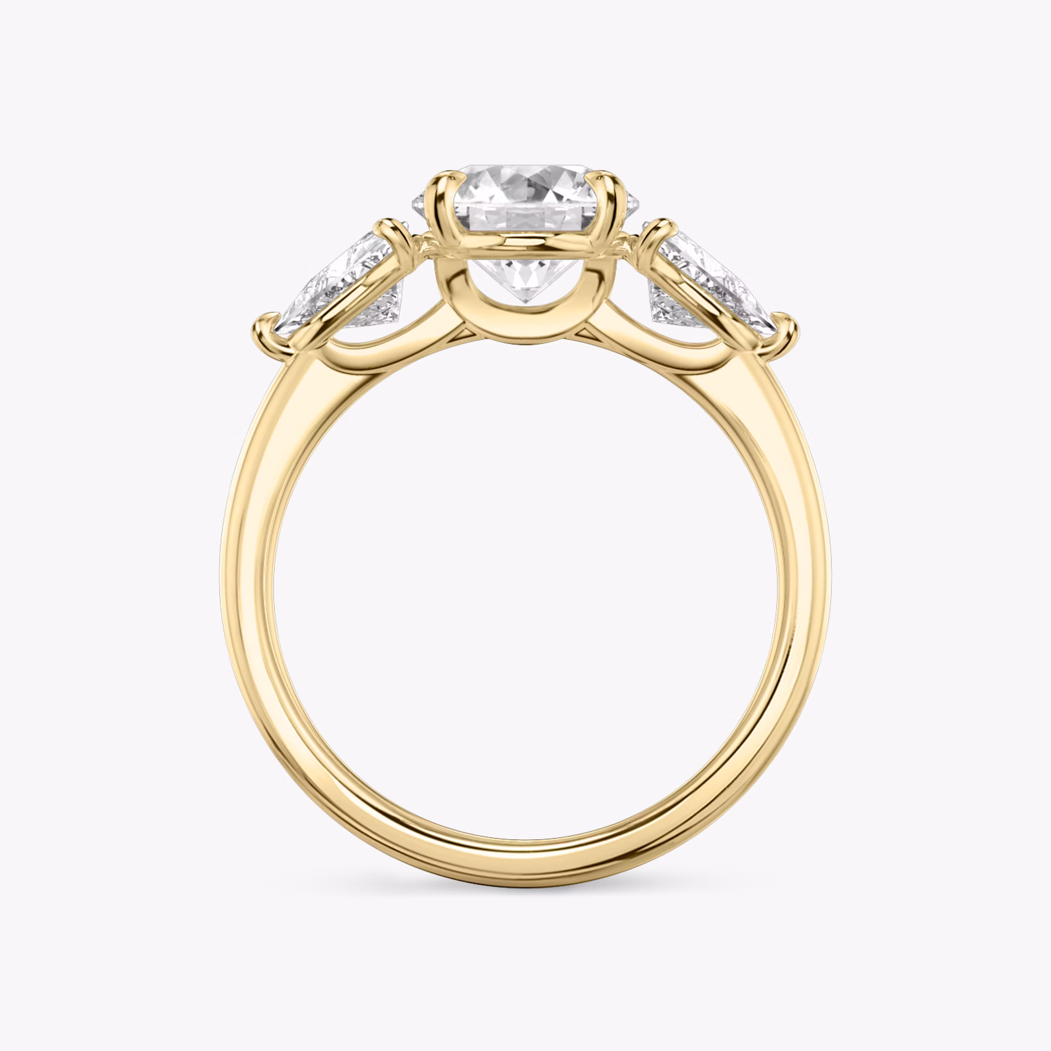 The Three Stone | Round Brilliant | 18k | Yellow Gold | bandAccent: Plain | caratWeight: other | sideStoneCarat: 0.50ct | sideStoneShape: Trillion | diamondOrientation: vertical