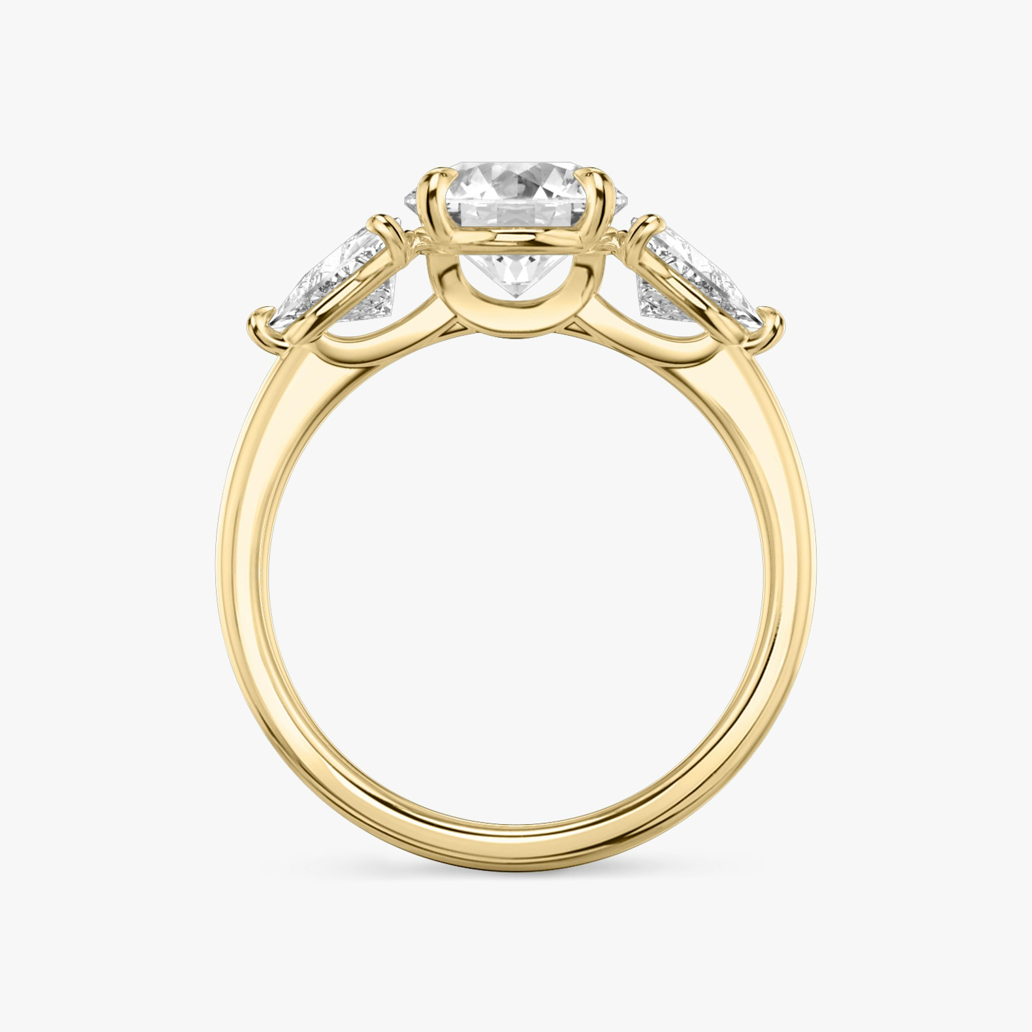 The Three Stone | Round Brilliant | 18k | Yellow Gold | bandAccent: Plain | caratWeight: other | sideStoneCarat: 0.50ct | sideStoneShape: Trillion | diamondOrientation: vertical